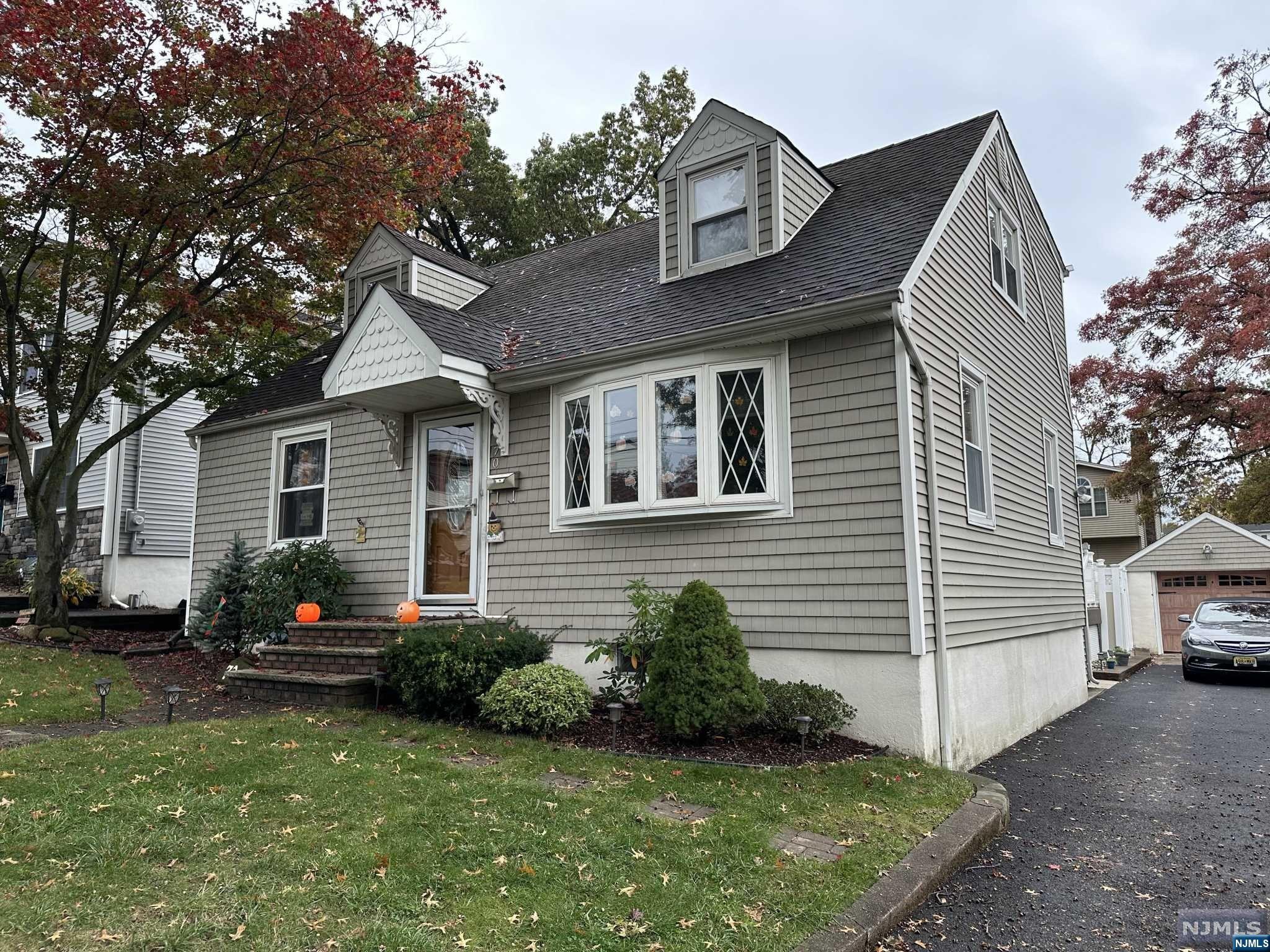 Enjoy this lovely, well maintained 7 room home featuring 3 bedrooms, 3 bath in a nice tree-lined street in sought after Hasbrouck Heights. The first floor features a newer kitchen with granite countertops, formal dining room, large bedroom, full bath and a large family room with a charming wood burning fireplace, and a laundry room/office. Glass sliding doors lead to a large deck overlooking an above ground pool. The second floor features 2 large bedrooms with lots of storage space, closet, and full bath. The basement is finished with a large den and another full bath. One car detached garage. 2 zone heating and 2 zone CAC. Convenient to all town amenities, beautiful parks nearby to enjoy and steps from local NY/NJ mass transportation. Excellent school system.