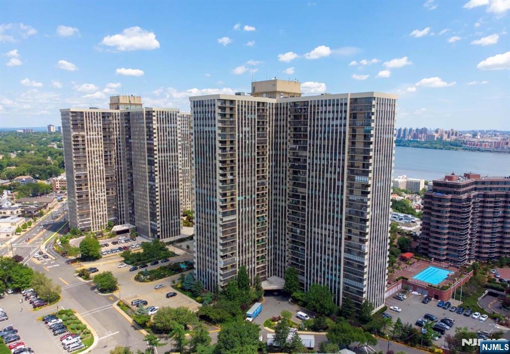 Easy living awaits at Winston Towers - a full service highrise building with a 24 hour doorman, pool, playground, playroom, community room, tennis, pickleball, and basketball courts. This spacious 1,533 sq ft condo is a great opportunity to make your own. It boasts 2 generous bedrooms, 2 full bathrooms, abundant closet & storage space, a huge open-concept living/dining area, an eat-in-kitchen, and your very own balcony with beautiful sunset views of the Meadowlands & beyond. Easy commute into NYC and conveniently located near shopping, dining, parks, and houses of worship. Parking is available and will be assigned after closing: $100 indoor, $150 tandem indoor, and $75 outdoor. Being sold strictly as-is. No credits or repairs will be provided. Certificate of occupancy will be the responsibility of the buyer. Listed by Romy Ouziel (917-922-9348 / Romy@WeinAgency.com).