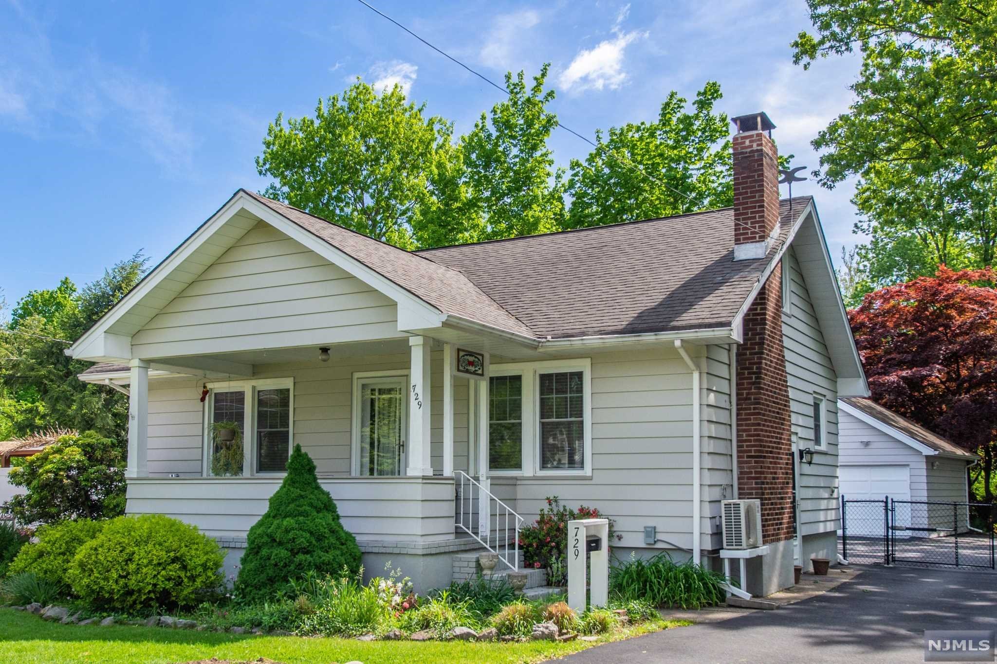 This Home is filled with exceptional features and offers an exceptional 1 Acre lot that backs to the Wanaque river. There is no threat of flooding for the residence and flood Ins is NOT required. Current owner has made some meticulous upgrades to the interior and has highly efficient heating and AC systems. The Huge detached garage will please anyone that is a car enthusiast or hobbyist. Home is loaded with charm inside and out. 3rd Bedroom space is in Attic and does not offer high ceilings. This home offers fantastic opportunity for expansion on 2nd level to increase living space further with addition that will have great views of wooded back yard. Large portion of Back Yard is fenced in and has an electric gate that opens with a remote. As you continue past the fenced in area you still have a few hundred feet to get to the Wanaque river. Back yard should sustain your wood burning fireplace for a VERY long time.