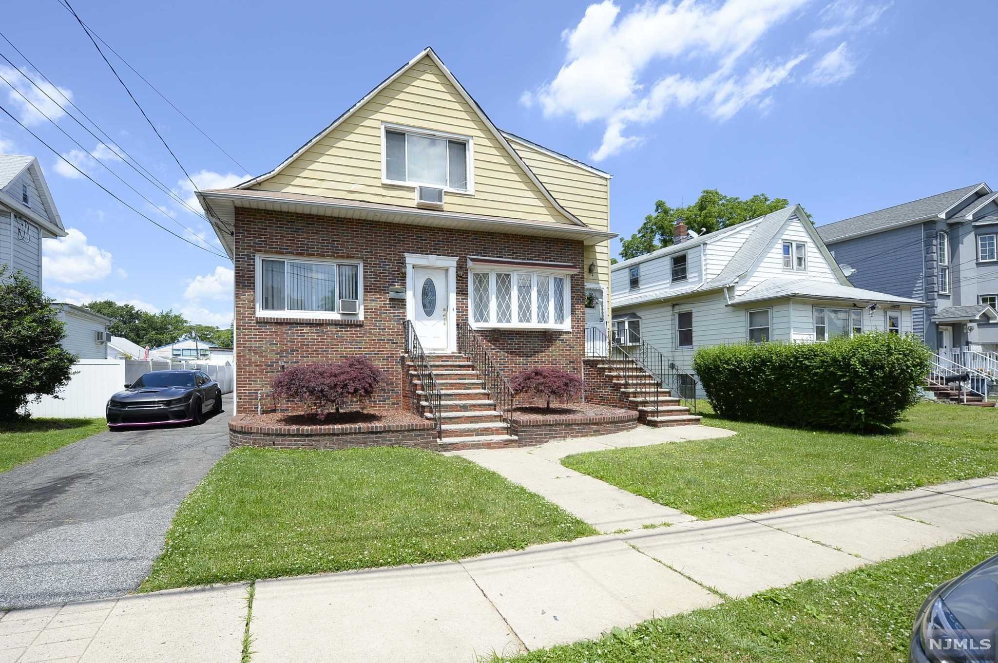 A little bit of love and affection will really make this solid, two-family home shine. Tremendous first floor, two-bedroom apartment with a newer kitchen...a fully, finished basement with full bath...a charming upstairs apartment with separate entrance...a 2 car garage and a built-in pool (in need of a new liner) complete the picture. Close to transportation, schools and shopping.