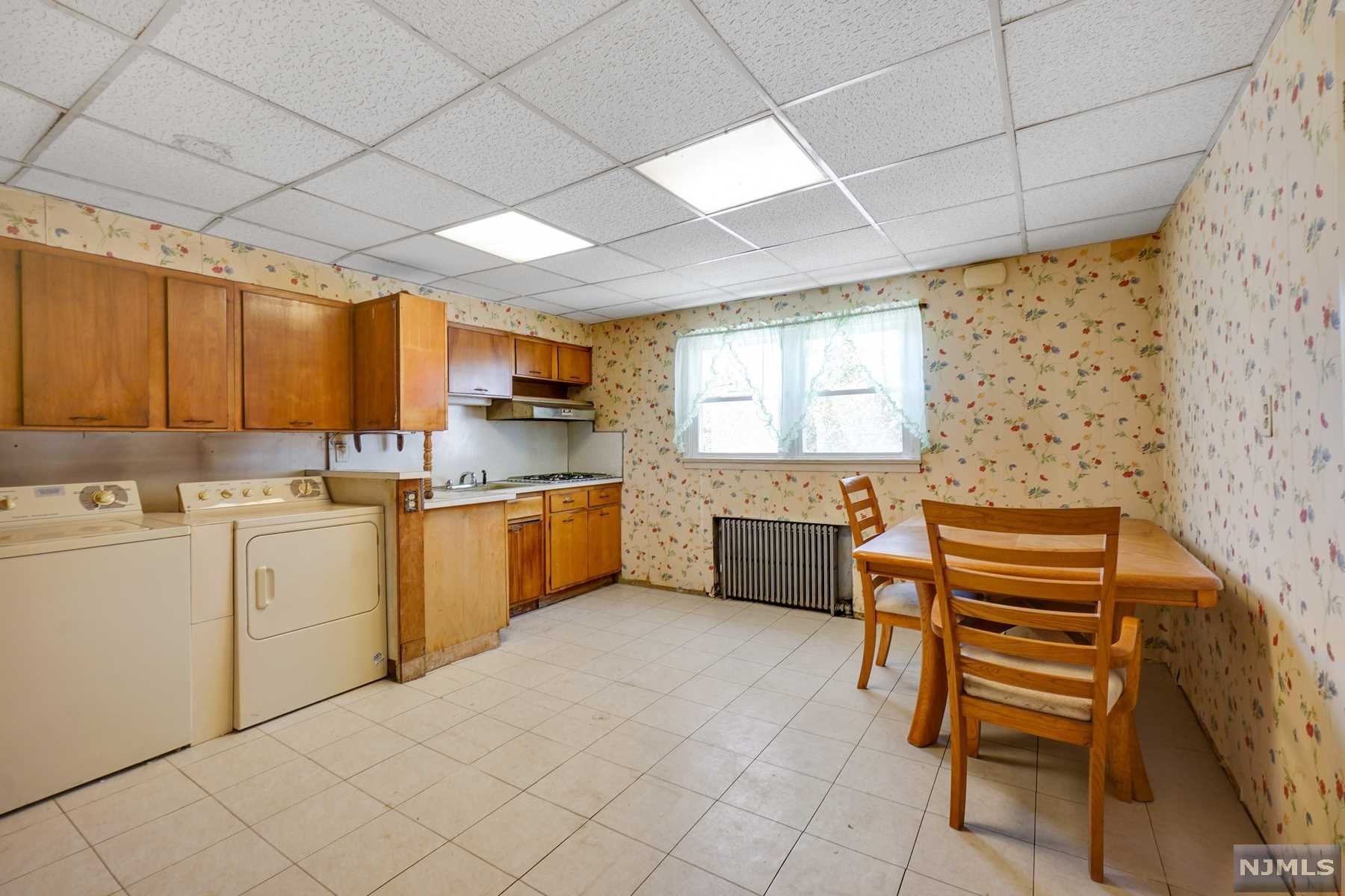 Opportunity to renovate this 2-family home. Offers high ceilings, updated windows, and potential to expand within the existing footprint of the house. Sold strictly 'as is'.