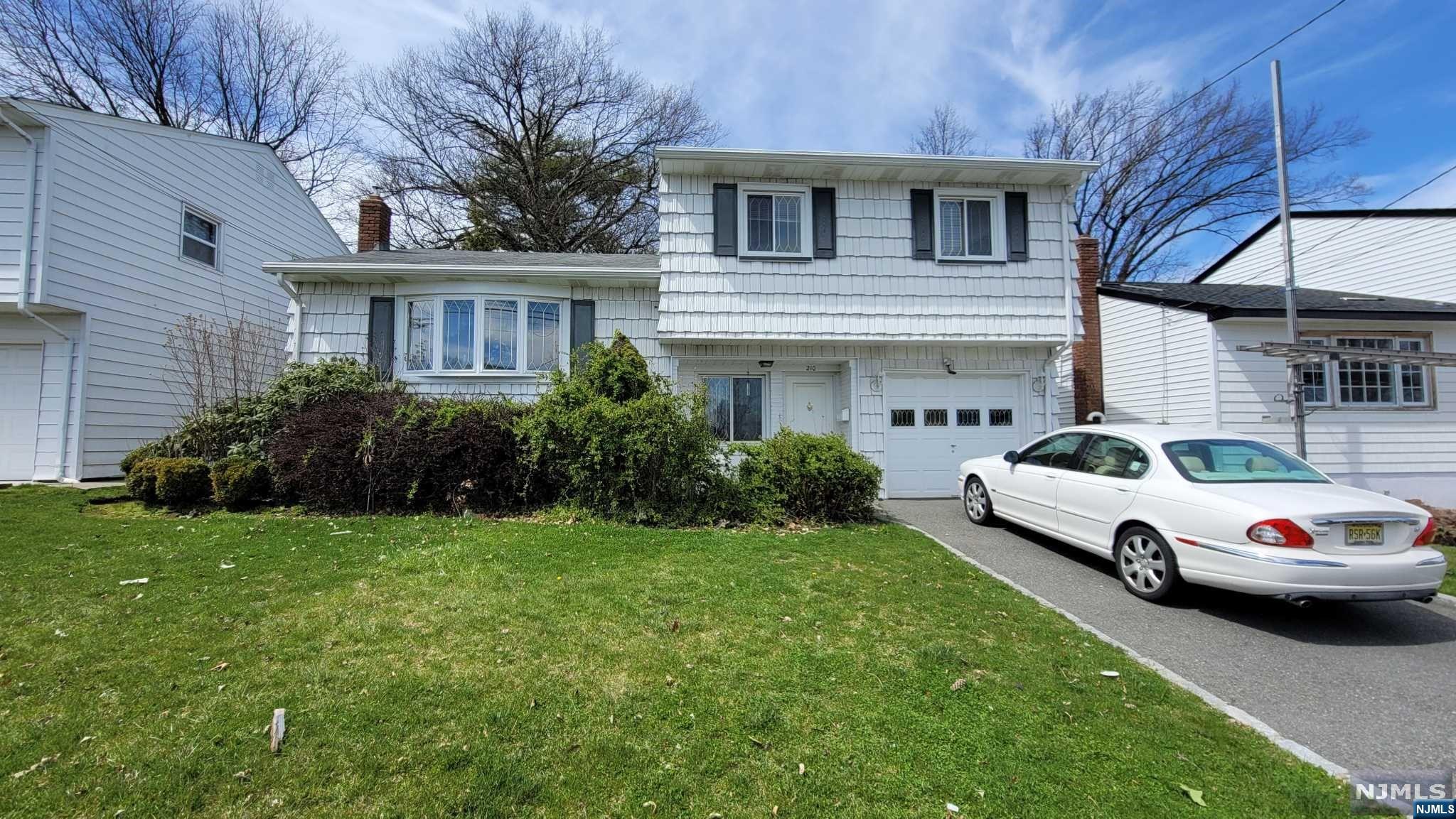 Charming spacious Sugar-Maple Split Level home which featured:Ent Foyer w/ lg closet, door to 1 car garage.Laudry Rm, 1/2 bath, door to patio & backyard.EIK w/ DW, plenty of cabinets. L-shaped LR/DR. 2nd Flr: MBR w/ Bath. Bath connects to 2nd BR. 3rd BR. Hall Closet. 3rd Flr: Attic, partial storage. Basement: 1 Finished Rm w/ Bar & Elec FP, Util. Rm, Storage. Hardwood floors as installed, carpeting as installed. Gas, C/A. Exterior: Aluminum. 1 Car attached garage w/ parking for 1 in driveway. Must See!OPEN HOUSE Sunday 8/18 2-4 PM