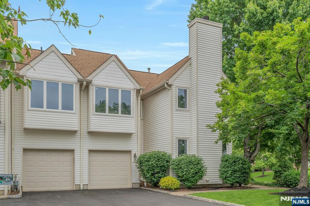 Welcome to The Meadows at Montville. This 3-bedroom, 3.5 bath end unit offers 2400 sq. ft. of spacious living with thoughtful flow and style. The main level features a vaulted-ceiling living room that opens seamlessly into a generous dining room with sliders to your own deck perfect for entertaining or unwinding outdoors. The kitchen offers plenty of space to cook and gather, while the den with fireplace adds a cozy touch. A powder room rounds out the first floor. Upstairs, you'll find two bedrooms, a full bathroom, and convenient second-floor laundry. A loft-style sitting area leads to the primary bedroom suite, complete with en-suite bath and walk-in closet. The full finished basement with a bonus full bath offers endless flexibility media room, guest space, or home gym. Plus: a 2-car attached garage and access to community amenities including a pool, gym, and clubhouse. All the space you need, with the community lifestyle you want.