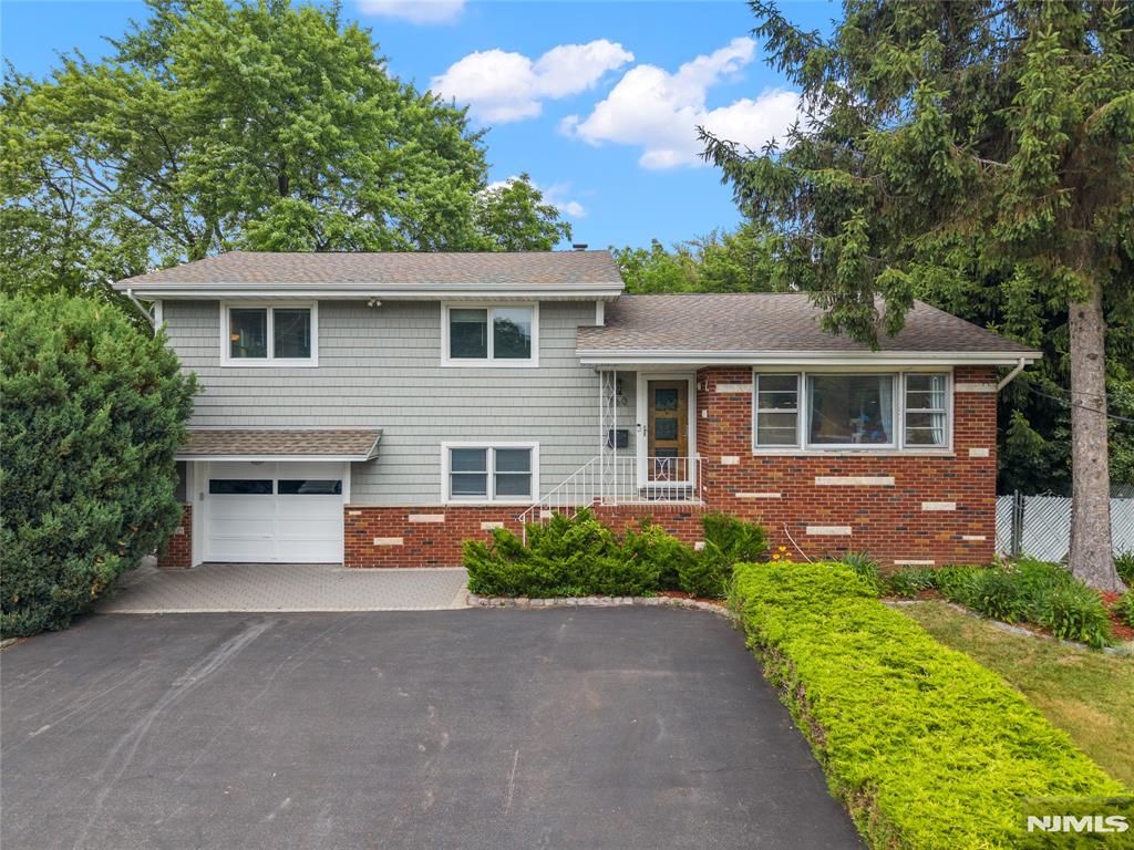 Welcome to this beautifully maintained 3-bedroom, 3-bath home nestled in Clifton's highly sought-after Montclair Heights section! From the moment you step inside, you'll be greeted by a warm and inviting layout featuring a spacious living room, elegant dining room, and a stunning eat-in kitchen complete with a center island perfect for everyday living and entertaining. The dining room seamlessly opens to a deck overlooking a spacious backyard, creating the perfect setting for summer barbecues, outdoor gatherings, or peaceful evenings at home. The thoughtfully designed layout offers comfort, functionality, and plenty of space for today's lifestyle. The finished basement provides endless possibilities and can easily serve as a recreation room, home gym, media room, playroom, or additional living space to fit your needs. Ideally located near highly rated School #16 and just moments from Holster Park, this exceptional home offers the perfect blend of suburban charm and convenience. Enjoy easy access to shopping, dining, major highways, and NYC transportation. Don't miss this incredible opportunity to own a beautiful home in one of Clifton's most desirable neighborhoods Montclair Heights!