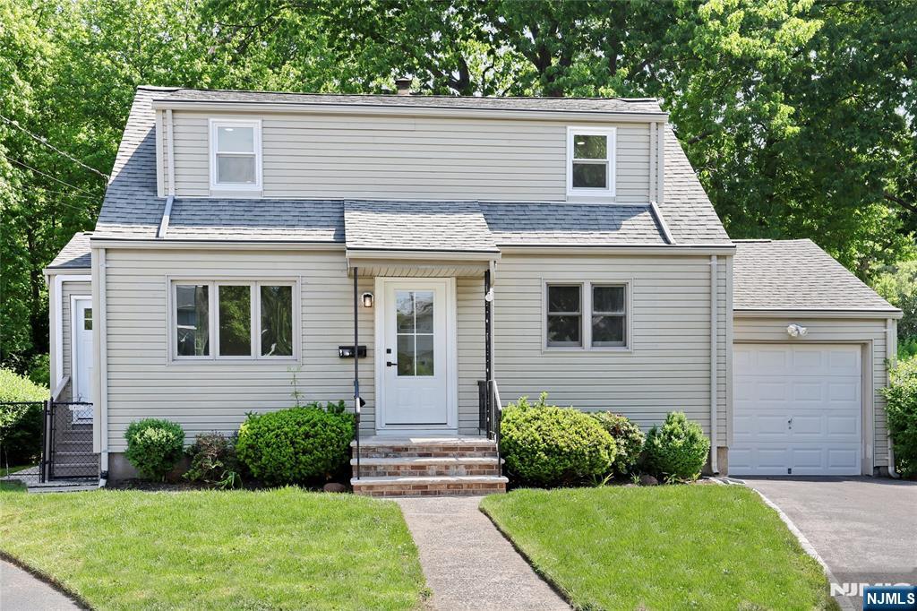Your home search ends here! Thoughtfully renovated with the finest finishes and craftsmanship, this inviting, turnkey Cape Cod home is nestled on an idyllic cul-de-sac. The main level has a beautiful, sunny living room with views of the charming neighborhood. The eat-in kitchen is fully updated with quartz countertops, stainless appliances, and quite-close cabinetry. This main level has two nice sized bedrooms and a full bath. The second level has a beautiful primary suite. This space offers a generously sized bedroom, modern bath, and a bonus loft space that can function as a nursery, workspace, den, and more. Down in the finished basement you'll find a spacious rec room and a private home office. The basement also offers a dedicated laundry area, utilities, and additional storage. Off the kitchen you have two access points to the spacious, fenced in backyard - a side door and a slider to the beautiful deck - an ideal setup to kick off summer BBQ season! The garage has front and back doors, making both parking your car or accessing your lawn equipment a breeze. Updates and benefits include a whole house generator, ductless mini-split systems in all rooms, all new flooring, new railings, recessed lighting and new light fixtures, new doors, and new hardware. NYC commuters have access to the NJT-166 bus line just two blocks away. The neighborhood is also conveniently located to shopping, parks, schools, and more. Don't wait - book your showing today!