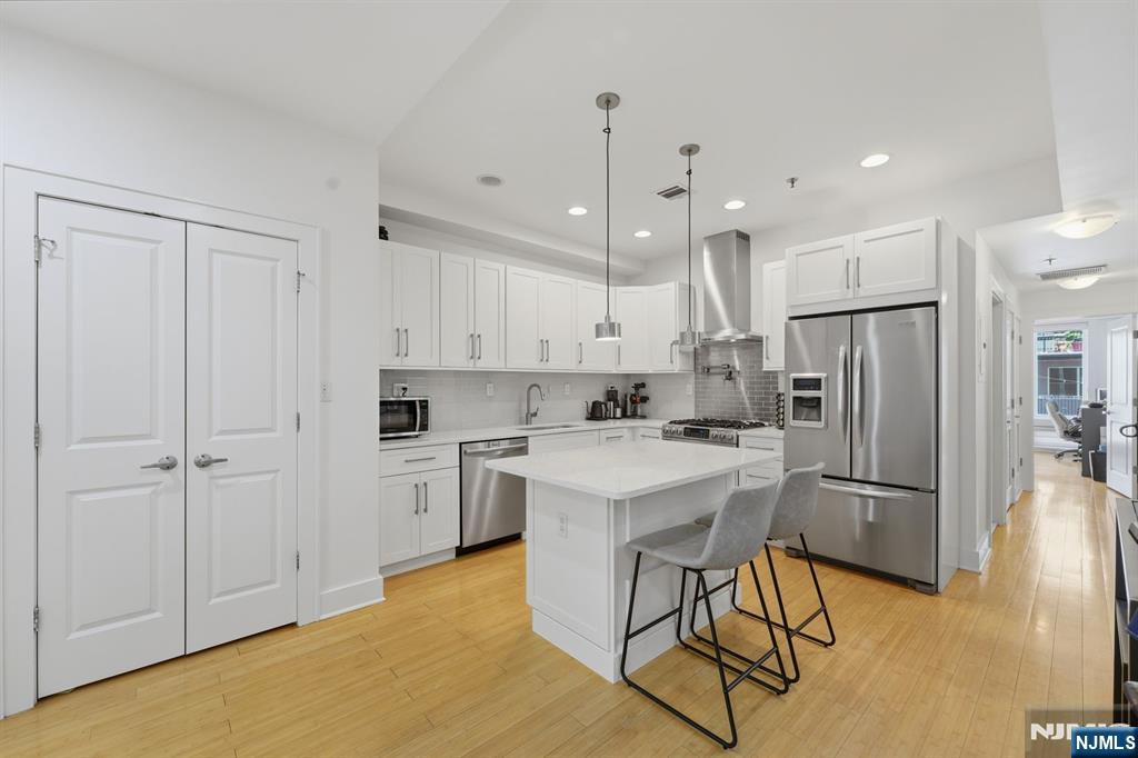 Stunning 2-bedroom / 2-bathroom home in the heart of Hoboken on Park Ave. Featuring an open floor plan with a renovated, fully equipped kitchen featuring custom glass backsplash, quartz countertops, and stainless steel appliances, including a pot filler. Spacious primary suite with a walk-in closet and en-suite bathroom. Second bedroom also features an en-suite bathroom. Bathrooms feature Porcelanosa tile and rain showers. Additional highlights include an abundance of closet space, washer/dryer, central air and a terrace.! Just moments to Washington Street, shopping, transportation to NYC, the Hoboken PATH, and Restaurants.