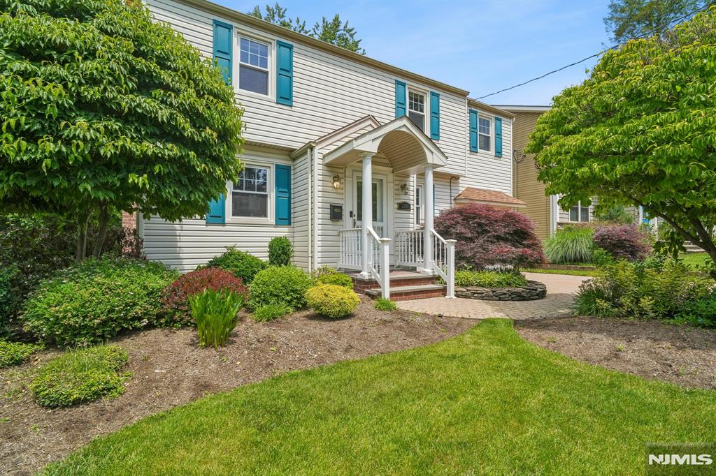 Welcome to this beautifully maintained Colonial set on a professionally landscaped property with a paver driveway and exceptional curb appeal. The first floor features gleaming hardwood floors throughout, a welcoming living room with a gas fireplace, and pocket doors that open to an expansive open-concept living space. The updated kitchen flows seamlessly into the breakfast nook and den, with sliders leading to a spacious Trex deck overlooking the private backyard. A formal dining room, full bath, and versatile mudroom/home office with laundry complete the main level. Upstairs, the spacious primary suite offers vaulted ceilings, a walk-in closet, and a private full bath. Three additional bedrooms provide ample space, including one with an adjoining office and walk-in closet. An additional full bath completes the second floor. Additional highlights include a generator, one-car attached garage, and a private backyard retreat designed for outdoor enjoyment. This move-in ready home offers the perfect blend of comfort, functionality, and style.