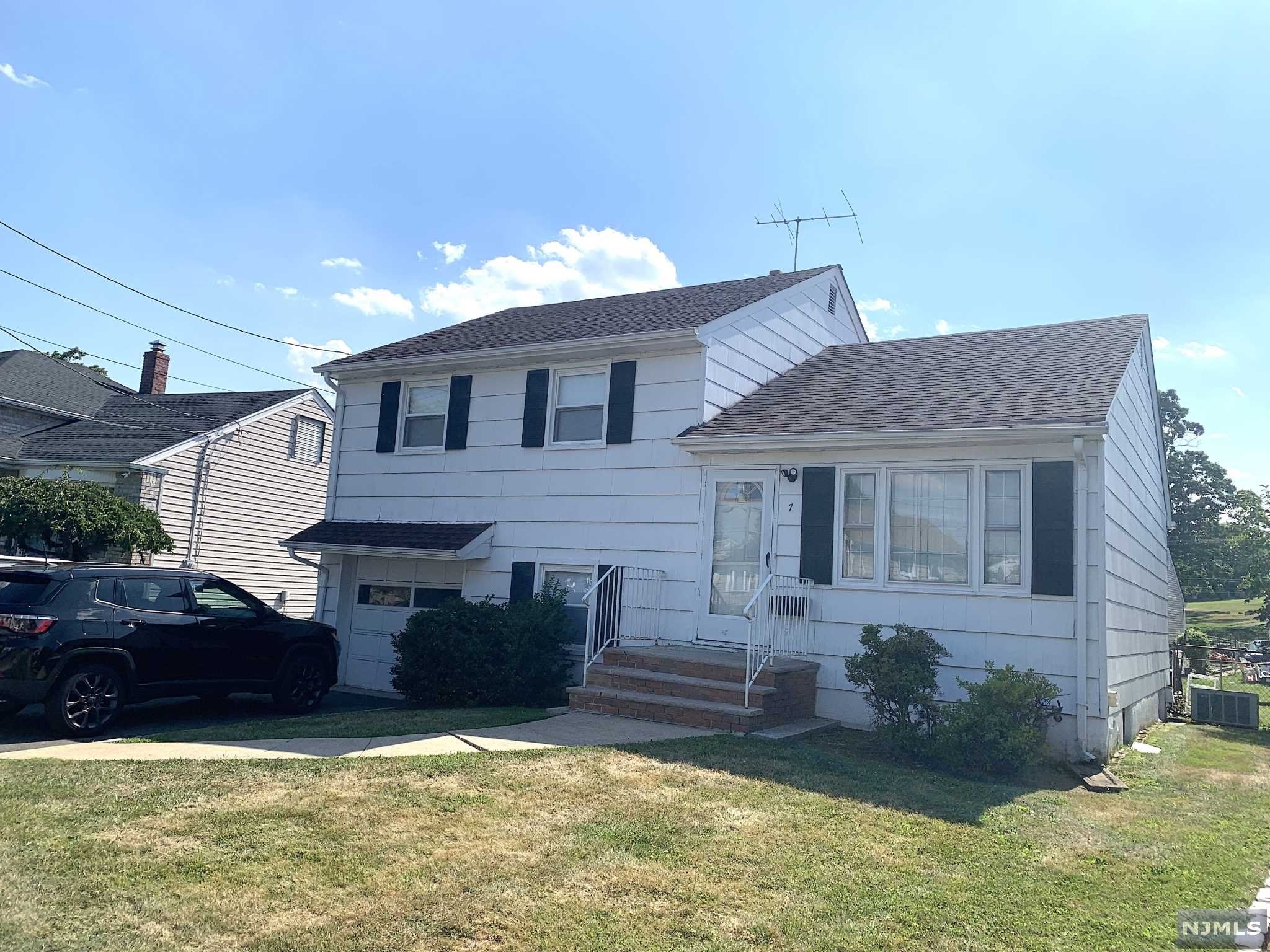 Welcome to this well built Rutan Estates split level located on the border line of Nutley and Bloomfield. Featuring central air conditioning, 3 bedrooms, one and a half total bathrooms, living room, dinning room, kitchen, ground floor family room with a half bathroom, and a partially finished basement. There is a large fenced in yard, patio, natural gas barbeque, and plenty of parking for up to 6 cars in a two car wide drive way with a one car garage which makes it great to host large outdoor events. Great convenient quite location within walking distance to public transportation, restaurants, entertainment, house of worships, schools, parks, shops, & stops. Gem in the rough with a little TLC. Price to sell immediately in "as-is-condition".