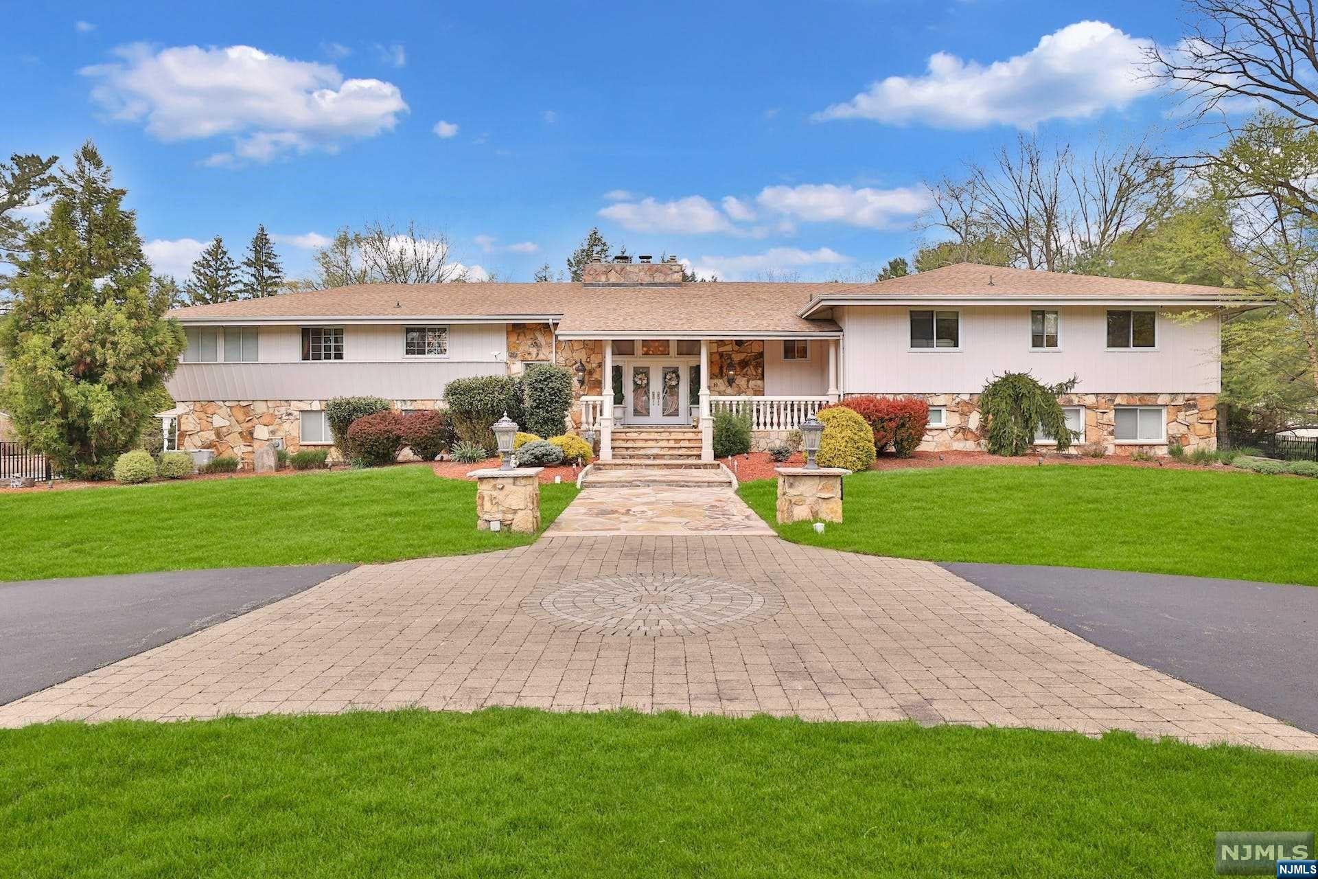 TIRED OF PAYING EXHORBITANT RENTS TO LIVE IN NEW YORK CITY? Welcome home to this sprawling 6 bedroom, 5 bath (over 5,700 square feet) beauty in Old Tappan, NJ which is often referred to as the "Jewel of Bergen County." Beautifully landscaped on over 1.2 acres, this magnificent home has an outside entertainment area with a gazebo, and an inground swimming pool surrounded by marble decking. Stunning chef's EIK with an elegant dining room and a balcony off the living room to enjoy the evening. Primary MBR with luxury bath ensuite provides a perfect spot to unwind after a busy day. Three other bedrooms on the main floor with one and a half baths. The second level has a summer kitchen and a large dining room (with a sliding glass door which leads to your sumptuous backyard), 2 bedrooms and 1.5 baths including an entertainment center which has a pool table, wine bar and a wine cellar to boot. Old Tappan has best in class schools, from K-12, all within walking distance from your home.