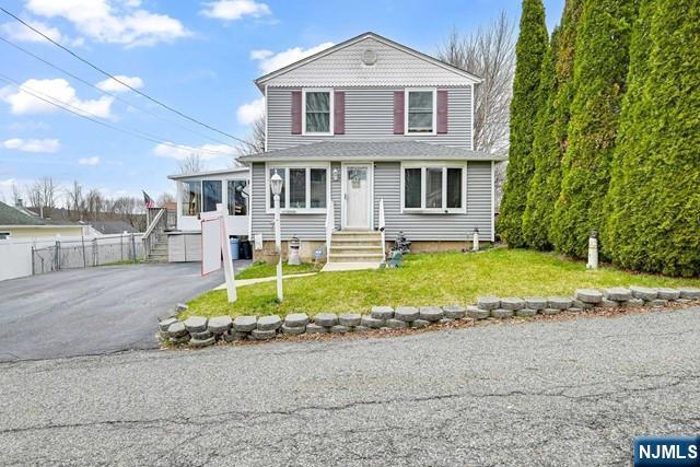 This Charming Colonial Home In The Upper Greenwood Lake Area Has 3 Bedrooms, 2 Bathrooms, And A 3 Season Sunroom Room Heated! Highlights Include A Pellet Stove, Newer Furnace, New Sunroom Windows, A Generac Generator, New Roof, Remodeled Kitchen, And A Beautiful Cambridge Stone Paver Patio! Updates Have Been Made Over The Years To Enhance The Property! The Property Also Features Central Air, Spacious Rooms, Ample Closet Space, And A Fenced-In Yard! Upper Greenwood Lake Offers A Variety Of Activities Such As Motor Boating, Kayaking, Swimming, Fishing, And Jet Skiing! Additionally, Residents Can Enjoy Year-Round Activities Including Shopping, Dining, Golf Courses, Ski Resorts, Wineries, Apple Orchards, Drive-In Theaters, And More!