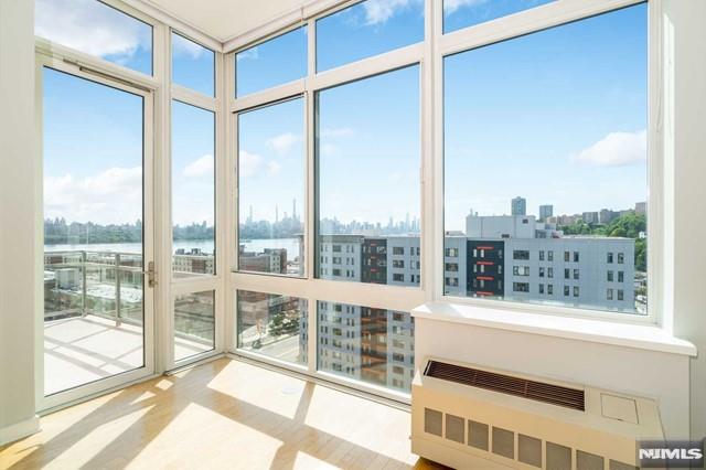 The Chen Agency(2 0 1 - 3 4 6 - 8 8 8 8) represents: PENTHOUSE 07 at ONE HUDSON PARK is a truly remarkable Gold Coast residence that will astound you. Located on the top floor, 746 sqf! Heat, Gas, Water & Parking are included in maintenance. Modern one-bedroom and one & half bathrooms with Southern exposure, New York City Views. An impeccably maintained building right off City Place & the commons and NYC transportation. Hardwood floors throughout. Top-of-the-line appliances with eye-catching details. 10.5 FT ceiling. Floor-to-Ceiling windows in the living room, glass-walled terrace, 24-hr doorman, gym. MUST SEE! Please reach out to Sophie at 201-281-5593 for a private tour.