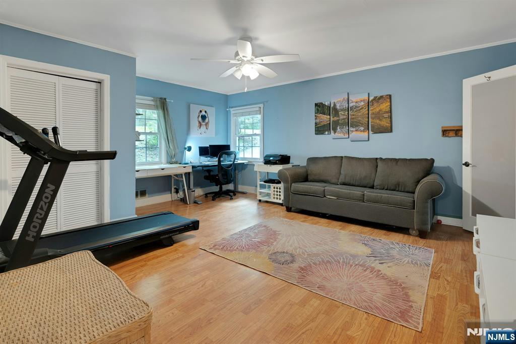 Opportunity awaits for the privileged Smoke Rise lifestyle; a hop, skip and jump to the Smoke Rise Beach!! Set in the heart of Smoke Rise, resting above the lake offering fabulous Winter water views and sunsets! Lovely home greets you with amazing entertainment room. Great flow into spacious dining rm that leads to spacious kitchen with large pantry and sun room. Walls of windows with fabulous woodlands surrounding. Walks out to large deck perched hilltop with patio and fabulous pizza oven for your lakeside entertaining. New fabulous siding and the original gorgeous granite exterior gives you a rich warm feeling. Enjoy Smoke Rise Days' spectacular fireworks display right from your own deck. Easy access from kitchen to 2-car garage. Main level also offers a full bath with fourth bedroom/ office and den. Retreat upstairs to laundry, main bath, 3 bedrooms to include large primary suite with a huge arched window facing the SR Beach, high ceilings, w/i closet, and full bath with large tub. Upper foyer includes storage as well. Large unfinished basement completes this wonderful home.