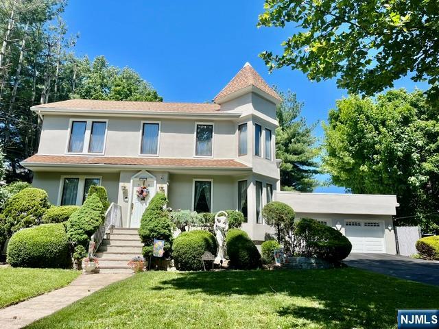 Original house was built in 1879 by the Christie Family, one of the earliest settles in Ridgefield Park and this is one of the largest lots in town, almost half an acre. This home offers a rare blend of privacy, space, and timeless appeal. The home is offering over 2,828 square feet of living space, great rooms with soaring high ceilings and abundant sunlight fills every corner. The first floor features a living room, dining room, custom built kitchen with mahogany cabinetry and a 100 bottles wine fridge built from floor to ceiling. One-bedroom, full bath and a beautiful four seasons sunny Florida room looking with access to the beautiful backyard, perfect for entertaining! Second floor, primary suite with a vast walk-in- closet and bathroom, provides convenience and privacy, while three additional bedrooms and full bath offer flexibility for a variety of living arrangements. Step outside to a breathtaking private backyard with a beautiful sitting area and enough space for a pool. The two-car garage with beautiful porcelain floors has access to two more rooms, a home gym and game room.!