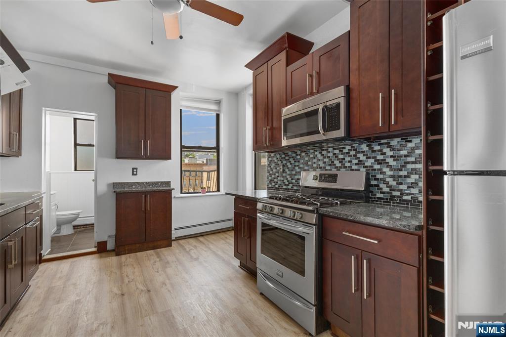 Bright top-floor one-bedroom residence located in a centrally situated Hoboken brownstone. This home features hardwood floors, high ceilings, an updated kitchen and bathroom, in-unit laundry, and ample closet space. Recent updates include newly installed flooring in the kitchen and living room, along with a newer washer and dryer covered by a transferable warranty for approximately three more years. Enjoy the added privacy of a top-floor location with no neighbors above. Low monthly HOA of just $300 includes water, common area maintenance, and waste management. Conveniently located near restaurants, shopping, parks, and multiple transportation options, including PATH, NJ Transit, bus service, and ferry access.