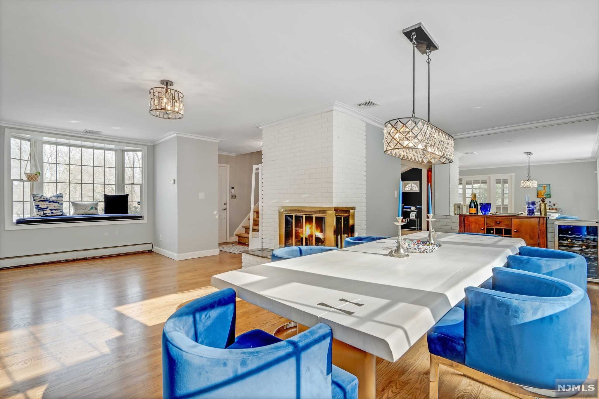 Located in a residential cul-de-sac, this gorgeous home has everything to enjoy a retreat lifestyle and still be close to the town center. This beautiful home has many recent upgrades and is 2,500 SF with an abundance of natural light. The first level includes wood floors, a modern exposed brick wall, and a fireplace. The living and formal dining rooms overlook the in-ground heated pool and a massive backyard with new fencing. In addition, it offers a very large office/den and a powder room. The spacious eat-in kitchen is well-equipped, with wooden cabinetry and granite countertops, and opens directly into the grand family room with vaulted ceilings, a fireplace, and a sunroom. The second level has a large master bedroom suite with jacuzzi tub, a separate stall shower, and built-in closets. Three additional sizable bedrooms and a full bathroom. Two car garage, large driveway, finished basement, new w/d, and lots of other extras. See it for yourself!