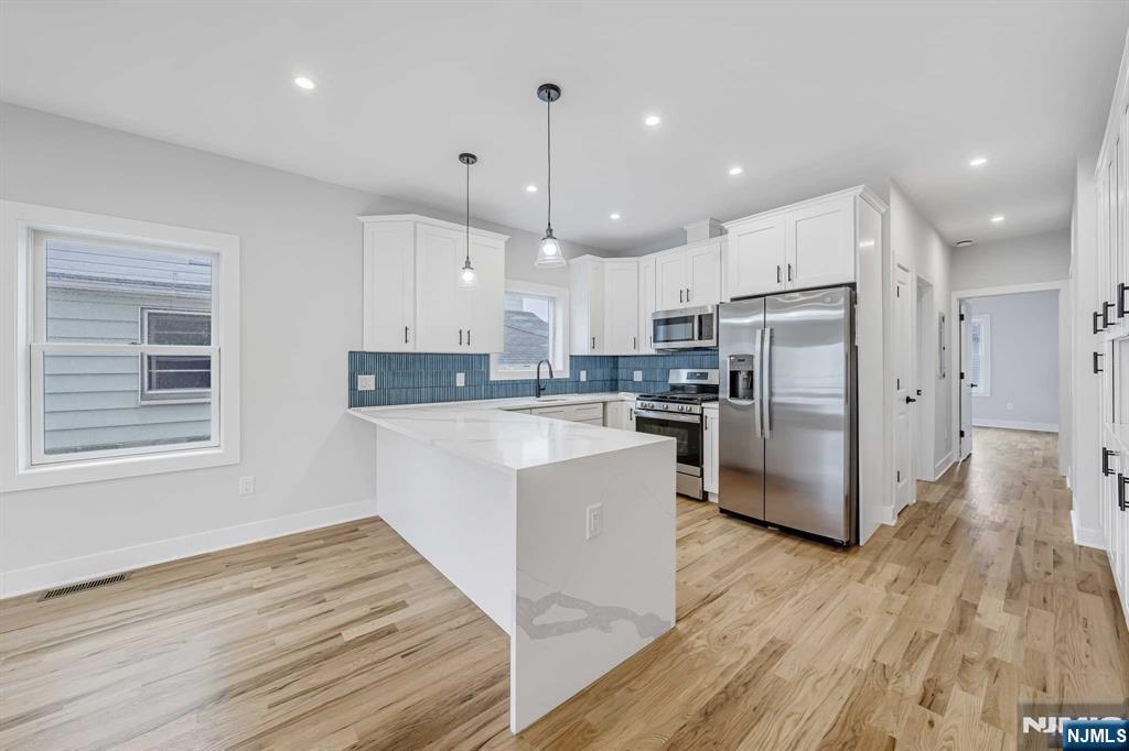 This is an exquisite and truly one of a kind 2 bedroom 2 bath apartment in a brand new construction! Beautiful and unique finishes all throughout. It features a primary bedroom with a private full bath, a must see!. Hardwood floors all throughout the unit and lots of space. Open layout for the formal living room and dining room with lots of sunlight giving it a radiant glow. Gourmet Kitchen fully equipped with stainless steel appliances and a breakfast bar, quarts countertops with elegant lighting. This luxury rental is a commuters dream! A mile away from the Harrison Path station and less than 2 miles from the Newark Penn Station. Easy commute to NYC and other parts of NJ. Minutes away from great selections of vibrant restaurants and cafes. Around the corner from NJ's famous Tops Diner! Close to parks, schools and so much more! All separate utilities. One car parking space may be available. Book your appointment today!!