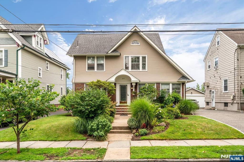 Welcome to this charming, well-maintained home in the highly desirable town of Rutherford, where pride of ownership is evident from the moment you step inside. The inviting first floor features a spacious living room with a beautiful fireplace and stained-glass window, a bright sunroom, a formal dining room, and an eat-in kitchen. Original woodwork throughout the home showcases the timeless character and craftsmanship that make Rutherford homes so special. The second floor offers three comfortable bedrooms and a full bathroom. A finished walk-up attic provides excellent flexibility and can easily serve as a fourth bedroom, home office, or bonus living space. The finished basement adds even more versatility with a family room, full bathroom, utility room, and workshopâ€”ideal for hobbies, storage, or additional living needs. Outside, a deep driveway leads to a detached two-car garage, while the generously sized backyard offers plenty of space for relaxing, entertaining, or outdoor activities. Conveniently located near NYC bus service and public transportation, this home combines classic charm with everyday convenience.