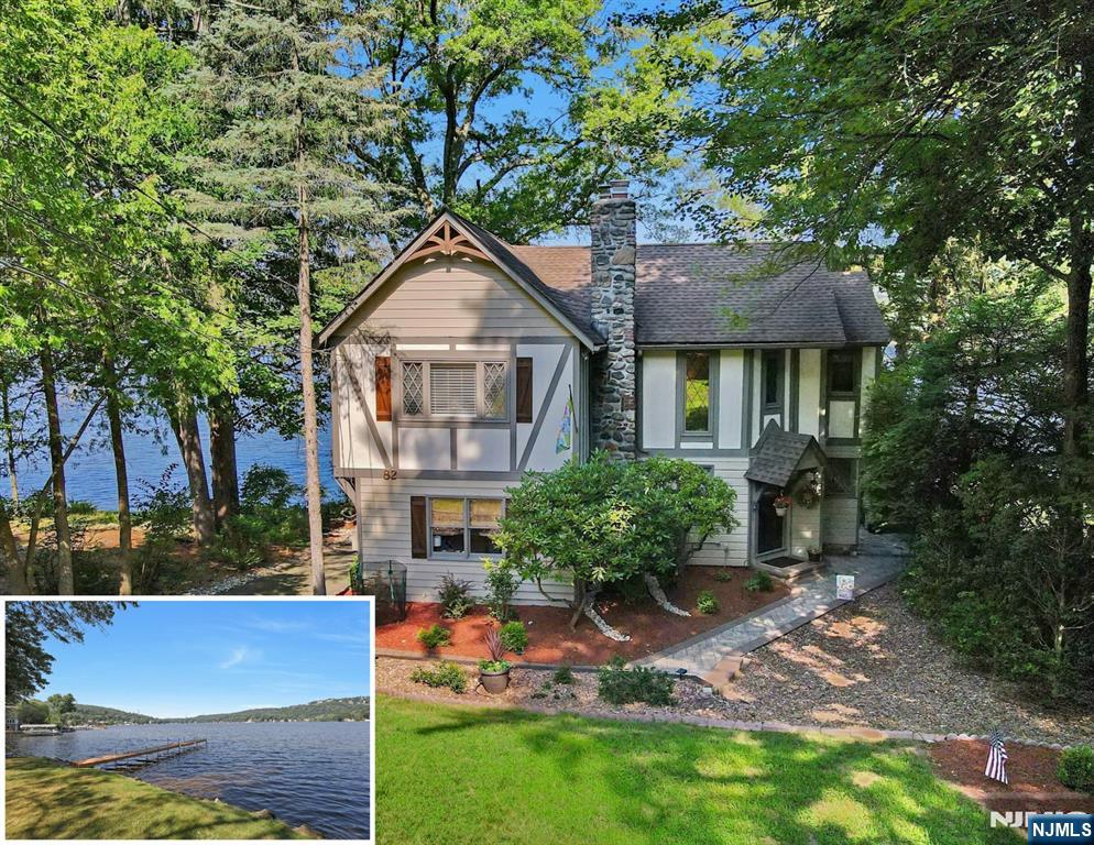 Experience lakefront living at its finest in this turnkey Tudor-style home, ideally situated on the highly desired picturesque Maple pkwy in the heart of Lake Mohawk. Boasting manicured grounds, breathtaking sunsets, and sweeping lake views, this meticulously maintained residence showcases exceptional craftsmanship and thoughtful design throughout. Just minutes from the charming LM Plaza, this 3BR + bonus room, 2.5 BA home offers a seamless blend of comfort, elegance, and amenities. The main level features a galley kitchen with an open-concept great room centered by a striking stone gas fireplace. Expansive deck perfect for entertaining or simply soaking in the serene lakeside setting. Add'l highlights on the 1st floor include a cozy den with a dry bar, a home office, and a beautiful full bath. Upstairs, the luxurious primary suite is a true retreat, complete with a walk-in closet and a renovated en-suite bath featuring a stall shower and refined finishes. Two add'l BRs and a laundry hookup complete the upper level. The finished lower level offers a generous den with walkout access to the beautiful level backyard and dock, ideal for entertaining. Modern systems include a new gas furnace, AC, water heater, along with ample storage throughout. Whether you're looking for a weekend escape or a year-round residence, enjoy all that LM offers all year around.. swimming, boating, kayaking, beaches, clubhouse, tiki bar, outdoor dining, and more! This exceptional home is move-in ready!