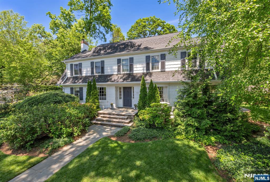 Nestled on over half an acre in Ridgewoodâ€™s sought-after Heights neighborhood, this beautifully expanded Center Hall Colonial offers over 4,000 square feet of thoughtfully designed living space. Featuring 5 bedrooms and an ideal layout for everyday living and entertaining, the home blends timeless elegance with modern comfort. A gracious foyer opens to a sophisticated front-to-back living room with fireplace and a formal dining room perfect for gatherings. The inviting family room with fireplace overlooks the lush backyard and flows into the renovated kitchen with high-end appliances, abundant cabinetry, and generous workspace. A laundry/mudroom, powder room, and charming screened porch complete the main level. Upstairs, the spacious primary suite features a walk-in closet and large spa-like bath. Four additional bedrooms and two full baths provide ample space for family and guests. The finished lower level includes a playroom, recreation space, and ample storage. Outside, the beautifully landscaped backyard offers an oversized bluestone patio, expansive lawn, large driveway, and two-car garage. Conveniently located near downtown Ridgewood, NYC transportation, and top-rated schools, this home offers the perfect blend of space, style, and location.