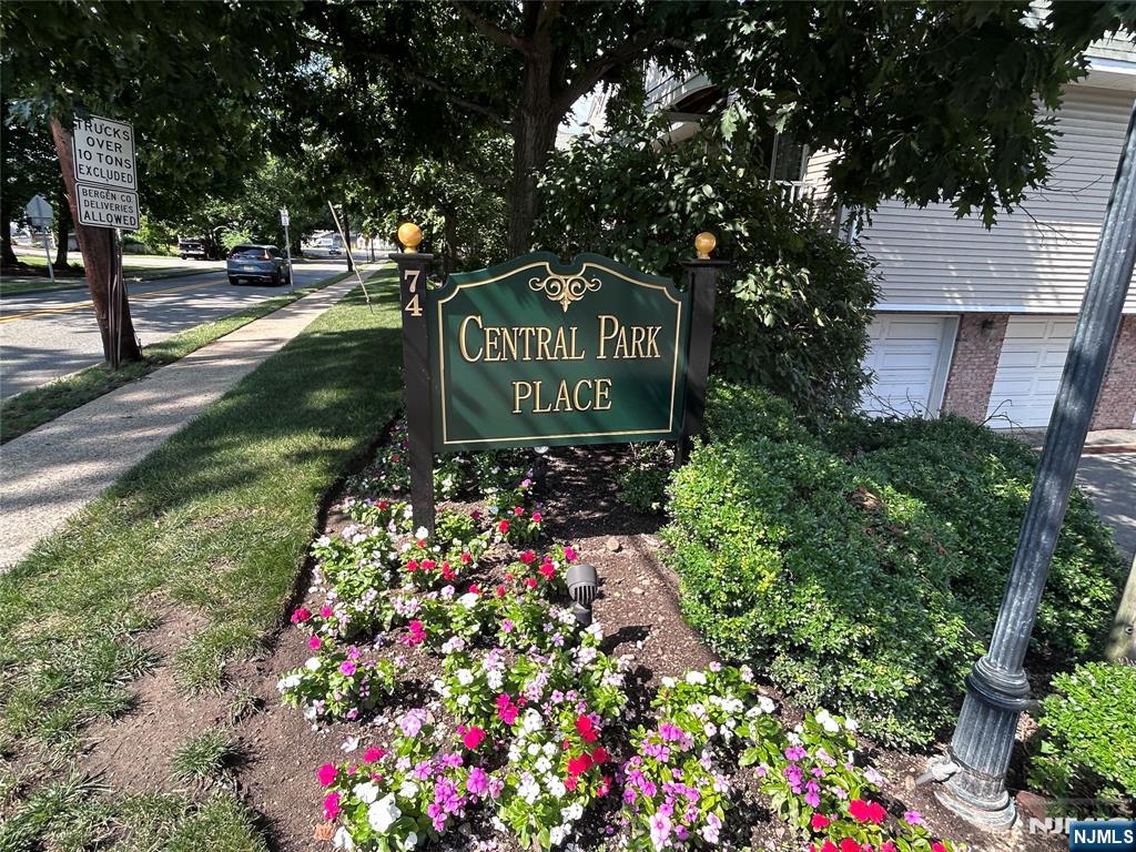 Welcome to this spacious 2-bedroom, 2-bath condo in the desirable Central Park Place community! This one-floor unit features an open-concept layout with a bright living room, hardwood floors, and sliding glass doors leading to a private deck. The updated kitchen offers granite countertops, tile backsplash, and bar seating, while the generous primary suite includes two large separate closets and an ensuite bath. A second bedroom and full guest bath provide added flexibility. Enjoy the convenience of in-unit laundry, a built-in one-car garage, one designated parking space (A), elevator access, and low-maintenance living. Ideally located just steps from downtown Ramsey's shopping, dining, parks, and NJ Transit, this home offers the perfect blend of comfort, convenience, and lifestyle.