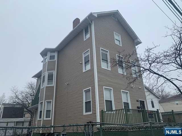 Fully renovated two family with a 3rd bonus unit. Use it as a duplex or 3 units. House comes with new central heating and cooling, new flooring, new kitchens on 2 units and an large basement full of Possibilities. In addition, the house offers a 50 x 100 double lot with 5 detached garages and possibility of subdivide and build. Owner is willing to do seller concession or owner financing on cash purchases.