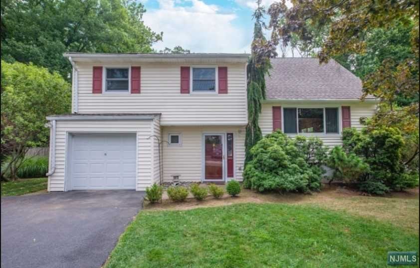 This expanded 4 Bedroom 2 1/2 Bath Split home is waiting for someone to make it their own. Located on a quiet tree lined street, the original owner has maintained this property and has made many updates. The entry foyer opens to French doors which leads to an oversized Family room with sliders that take you out to a huge Patio overlooking a large private fenced in yard, perfect for outdoor entertaining. The Living room and Dining room are filled with afternoon sunshine, sliders from the DR leads to a large, new Trex deck. The updated Kitchen has a new DW and Microwave and Granite counter tops. There are 3 Bedrooms and a full Bath on the 2nd level, Master has a walk in closet. The 4th bedroom is on the next level with a 1/2 bath and sliders to a new Trex deck..There are Hardwood floors throughout except FR. Basement is finished. Roof replaced 4 years ago, Heat and AC 2yrs, many windows replaced, Trex decks,2years