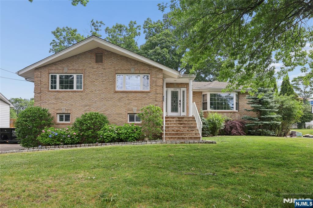 Stunning 4-Bedroom, 3-Bath Bi-Level Light-filled and beautifully updated, this spacious south/west-facing bi-level checks every box. Meticulously maintained and freshly painted throughout, all that's left to do is unpack. Gleaming hardwood floors and recessed lighting run through the entire home, creating a warm, cohesive feel from top to bottom. The large, sun-drenched kitchen is a true centerpiece â€” featuring granite countertops, quality cabinetry, stainless steel appliances, and a skylight that pours in natural light all day long.Generous master suite, complete with a relaxing Jacuzzi tub, separate shower, two walk-in closets, and its own skylight. Three additional bedrooms and two full baths provide plenty of room for family, guests, or a home office. Outside, a handsome brick-paved driveway leads to a two-car attached garage. Major systems are in excellent shape â€” including a brand-new roof (replaced just one year ago), three-zone heating, and central air conditioning supplemented by an additional wall unit on the lower level. A large laundry room adds everyday convenience. Situated on an approximately 85 × 117 lot with an easy commute to New York City, this home offers the space, style, and location today's buyers are looking for.