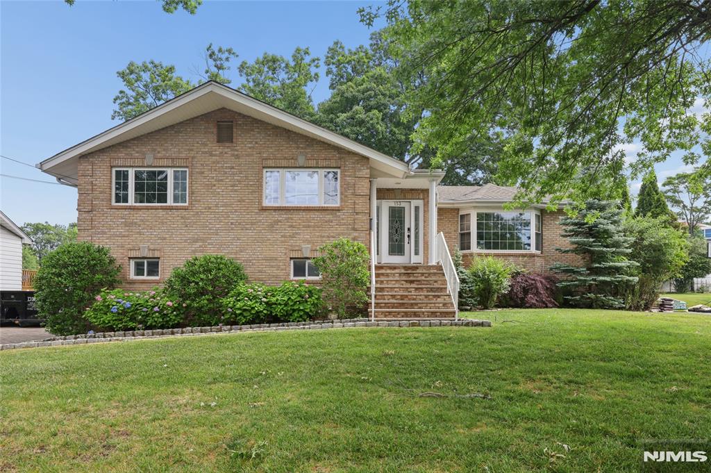 Stunning 4-Bedroom, 3-Bath Bi-Level Light-filled and beautifully updated, this spacious south/west-facing bi-level checks every box. Meticulously maintained and freshly painted throughout, all that's left to do is unpack. Gleaming hardwood floors and recessed lighting run through the entire home, creating a warm, cohesive feel from top to bottom. The large, sun-drenched kitchen is a true centerpiece â€” featuring granite countertops, quality cabinetry, stainless steel appliances, and a skylight that pours in natural light all day long.Generous master suite, complete with a relaxing Jacuzzi tub, separate shower, two walk-in closets, and its own skylight. Three additional bedrooms and two full baths provide plenty of room for family, guests, or a home office. Outside, a handsome brick-paved driveway leads to a two-car attached garage. Major systems are in excellent shape â€” including a brand-new roof (replaced just one year ago), three-zone heating, and central air conditioning supplemented by an additional wall unit on the lower level. A large laundry room adds everyday convenience. Situated on an approximately 85 × 117 lot with an easy commute to New York City, this home offers the space, style, and location today's buyers are looking for.