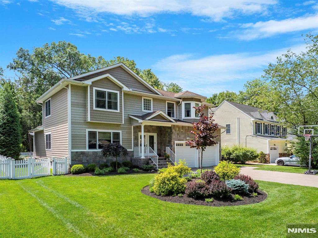 Welcome to 66 Andover Terrace, a distinguished residence in the heart of Glen Rock, NJ. This 10-year-old home offers a harmonious blend of modern design and comfort, featuring five spacious bedrooms and four well-appointed bathrooms. The open layout seamlessly connects the living, dining, and kitchen areas, creating an inviting space for both relaxation and entertainment. The gourmet kitchen is equipped with top-of-the-line appliances and opens to an impressive outdoor kitchen, perfect for alfresco dining and gatherings. The primary bedroom is a private retreat, complete with an en-suite bath that provides a spa-like experience. Additional bedrooms offer ample space and flexibility for family, guests, or home office needs. Entertainment options abound with a dedicated movie theater room, providing a cinematic experience from the comfort of your home. The property is ideally situated in Glen Rock, known for its vibrant community and excellent schools, making it a desirable location for families. 66 Andover Terrace combines luxury and practicality, offering a unique opportunity to own a home that caters to every lifestyle need. Experience the best of suburban living with easy access to local amenities and transportation links. Don't miss the chance to make this exceptional property your new home. Contact us today for a private viewing.