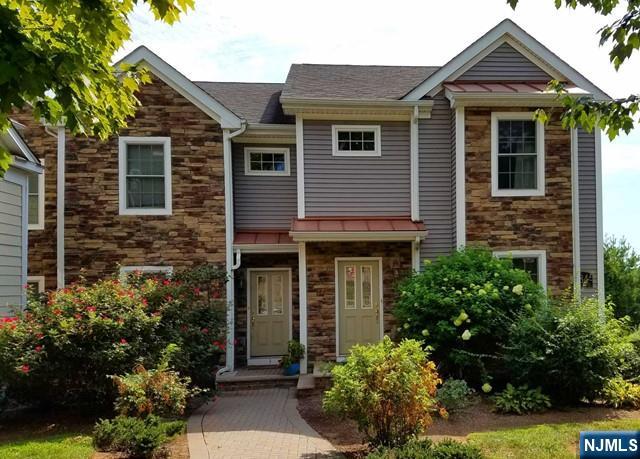 Experience the perfect blend of suburban comfort and urban accessibility. Nestled in the heart of River Edge, this younger, sun-drenched townhome offers an upscale lifestyle just steps from everything you need. The pristine home delivers upscale, turn-key living featuring a rare, spacious 2-car garage with ample storage and a private deck perfect for relaxing or outdoor entertaining. Located just minutes from River Edge's vibrant shopping, dining, top-rated schools, and parks, you will enjoy an effortless NYC commute, situated just a short, convenient walk to the NJ Transit train station and NYC bus lines. Ready for you to move right in and enjoy the best of Bergen County living.