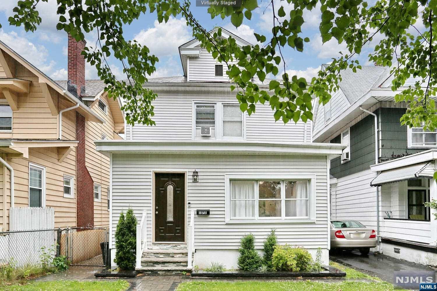 Welcome to this charming colonial-style home. This meticulously maintained home has been beautifully renovated in the last four years. This residence features three bedrooms and two full baths, offering a perfect blend of historic charm and modern updates. With high ceilings, architectural details and hardwood floors add a touch of character and elegance to the home. Any cook will appreciate the SS appliances, ample storage and counter space this open kitchen has to offer. This gem provides an ideal setting for creating lasting memories. Please note it is a shared driveway.
