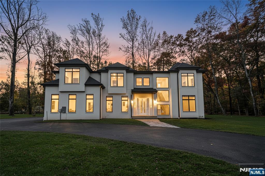 Unveil River Valeâ€™s most coveted estate, where modern design and natural tranquility come together. Set on 2.7 private acres, this 4,400 sq ft new construction smart home plus a spacious bonus basement, showcases exceptional craftsmanship and future potential, with 5 expansive bedrooms and 4.5 custom bathrooms, including a primary bath with a luxurious wet room and soaking tub. he chefâ€™s kitchen features GE Monogram appliances and custom cabinetry, while wide-plank white oak flooring flows throughout. Black-framed windows highlight the contemporary aesthetic, and the hard-coat cement exterior ensures lasting durability. With 10-ft ceilings on the first floor and 9-ft ceilings on both the second level and lower level, every detail has been designed with comfort and style in mind. The property also includes a 3-car attached garage, and the high-efficiency heating and cooling systems complete the home. A distinctive new construction opportunity in River Vale.