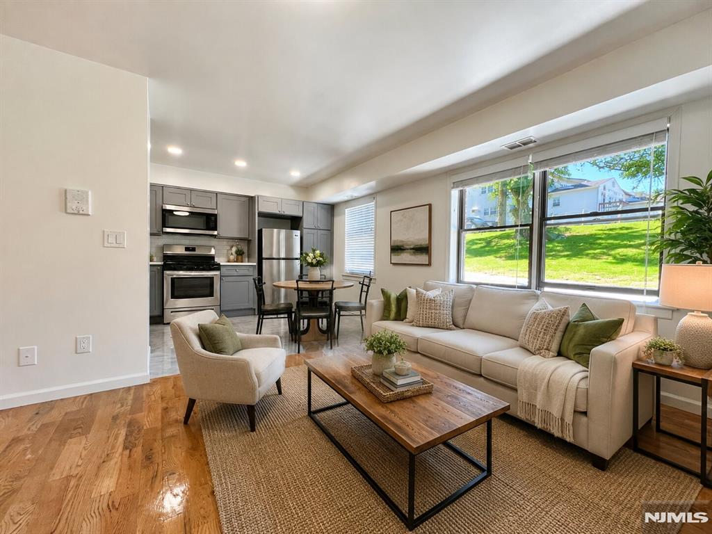 Welcome to Heather Glen in Kearny's desirable Arlington section. This recently renovated and beautifully maintained first-floor 1-bedroom, 1-bath condo offers comfort, convenience, and affordability all in one. Featuring a bright and spacious open-concept living and dining area, an updated kitchen, a generous bedroom with ample closet space, and a full bathroom, this move-in-ready home is designed for easy living. Central heat and air conditioning, in-unit laundry, and an assigned parking spot right in front of entrance. Ideally located near schools, parks, shopping, and dining, this condo offers exceptional convenience for everyday living. Enjoy easy access to public transportation, major highways, and a quick commute to New York City. World-class shopping, entertainment, and attractions at American Dream are just minutes away. Perfect for first-time buyers, downsizers, or investors seeking a prime location in one of Hudson County's most commuter-friendly communities. Don't miss this opportunity to own a stylish, updated home close to everything you need.