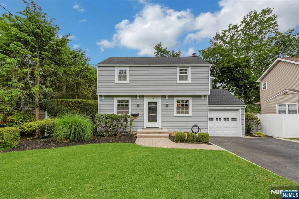Discover a rare sense of privacy and openness at this beautifully maintained Colonial in one of Tenafly's most desirable locations. Bathed in natural light and offering unobstructed vista views, this 4-bedroom residence features approximately 2,600 square feet of inviting living space, including a spectacular 700-square-foot primary retreat with dual walk-in closets. Thoughtfully designed for indoor-outdoor living, the home boasts multiple entertaining spaces, a lush private backyard, and a flourishing vegetable garden with automatic irrigation. A new roof installed in December 2025 completes this exceptional offering, just moments from Tenafly's premier schools, vibrant downtown, and easy access to Manhattan.