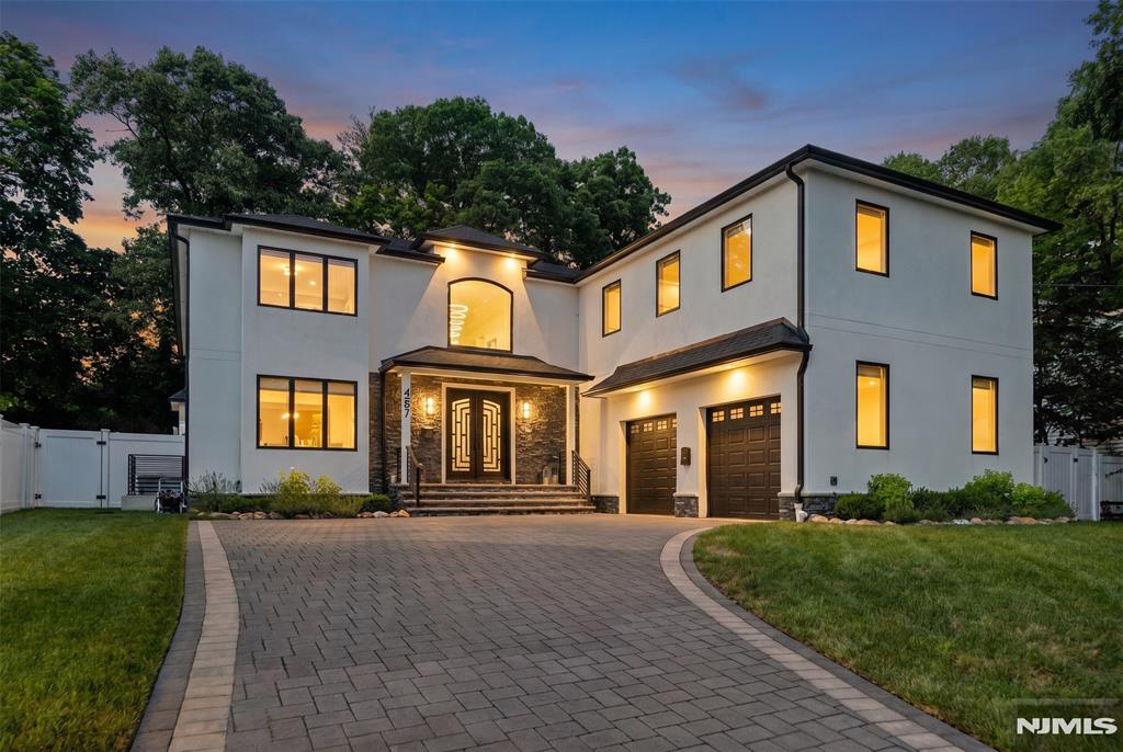 Brand new construction that was built in 2023 and meticulously maintained ever since, this stunning East Side Paramus colonial offers an exceptional combination of luxury, space, and modern design. Set on an oversized, deep lot, the home features 7 bedrooms and 6.5 bathrooms across a thoughtfully designed floor plan. A dramatic two-story entry foyer welcomes you into the home, leading to a gourmet chef's kitchen, spacious dining room, formal living room, and expansive family room with a gas fireplace. A first-floor bedroom and full bathroom provide ideal flexibility for guests or extended family. The family room opens to a spectacular covered patio overlooking the enormous backyard, creating the perfect setting for outdoor entertaining. The second level offers four generously sized bedroom suites, each with its own private bathroom and walk-in closet. The luxurious primary suite serves as a private retreat, complete with a spa-inspired bathroom and oversized walk-in closets. The fully finished lower level adds incredible living space, featuring a large recreation room, two additional bedrooms, a full bathroom, and a gym area. Additional highlights include a 2-car oversized attached garage, premium finishes throughout, and exceptional quality construction. A rare opportunity to own a nearly new home in one of Paramus' most sought-after East Side locations.