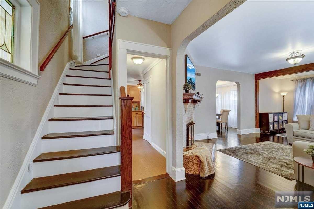 Prepared to be enchanted when you enter this Side-Hall Colonial that presents a foyer entrance adorned with a glass paned door that opens to an expanded living room which is enhanced by a beautiful fireplace to warm you on chilly nights. The dining room and updated kitchen open up to a deck and back yard for enjoying relaxing evenings. Proceed upwards to the 2nd level where you will find 3 spacious bedrooms adorned with wood planked ceilings and a full bathroom. The finished basement offers the laundry room, storage space, utility room, and tiled floors that open up to a bonus room that could be utilized as a media room, play room, or office. Lastly, the 2-car, detached garage is oversized and has a vast loft area for additional storage space, or can be finished as office space, or an art studio. Close to all major travel arteries, ease of commute to NYC & sought after school district. OPEN HOUSES * SATURDAY, Aug 3rd & SUNDAY, Aug 4th from 2pm - 4pm * Offers by August 7th at 3pm