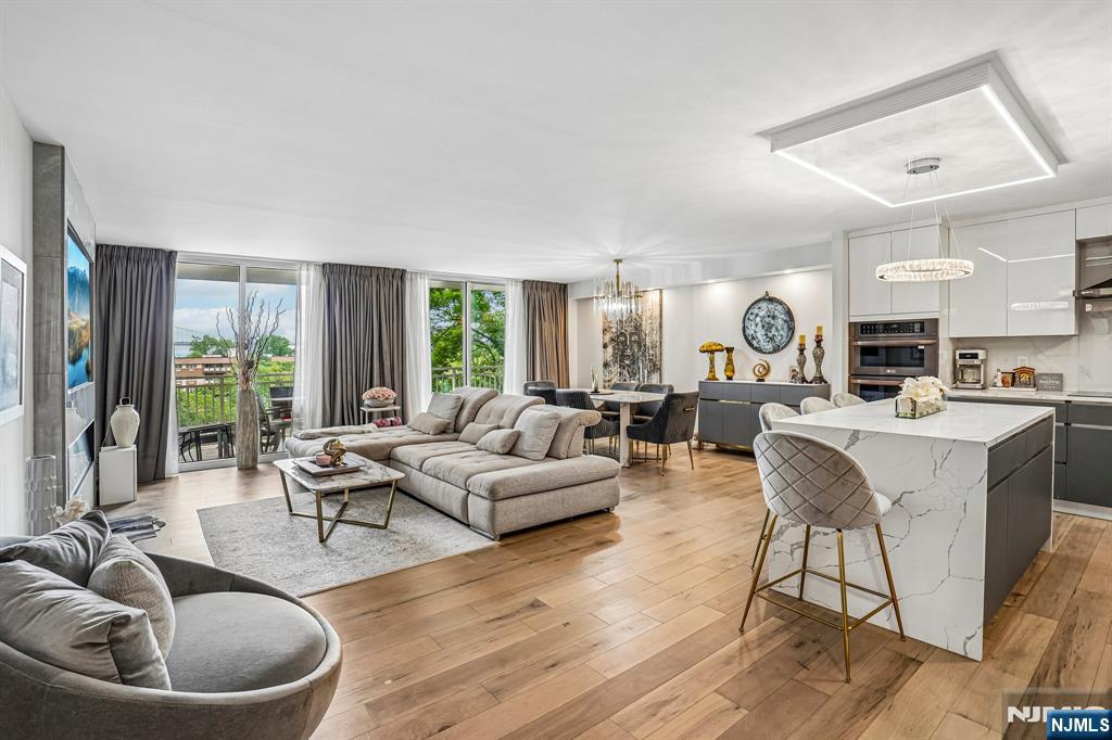 Stunning and rare, masterfully crafted, sold furnished with designer Italian furniture, largest two-bedroom, two-bathroom residence with many custom elements in Edgewater's Admiral Walk condominium known for its amazing amenities and outdoor living. This unparalleled, gut renovated, sanctuary-like residence with elegant flow that accommodates both formal and casual living, offers majestic views of GW Bridge and Hudson River, floor to ceiling windows, oversized living and dining area, open concept kitchen with top-of-the-line finishes, hardwood floors throughout, abundance of closets and storage space and large terrace. This exquisite, 24/7 concierge building is located on the banks of Hudson River, with easy commute to NYC by ferry or bus, near great shopping, restaurants and so much more...