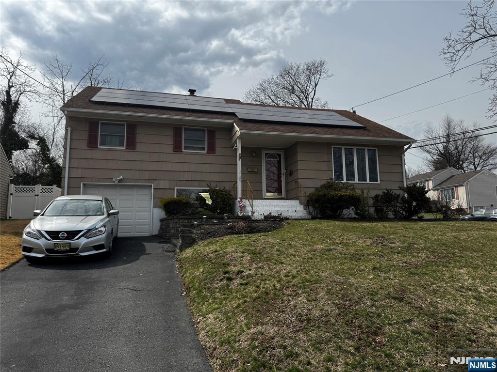 Charming Brookdale AreaCorner Split Level. Bright foyer entry, Cozy eat in kitchen with white cabinets & stainless steel appliances. Opened living room & dining room with beautiful hardwood floors. 3 bedroom/2 Full baths. Master bedroom features full bath, nursery/sitting area and plenty of closet space. Lower level with tv/den, laundry and entry to attached one attached car garage. Central Air. Basement includes family room, office or exercise space. Large backyard with deck. Easy assess to Rt 3. Close to park and NY bus.