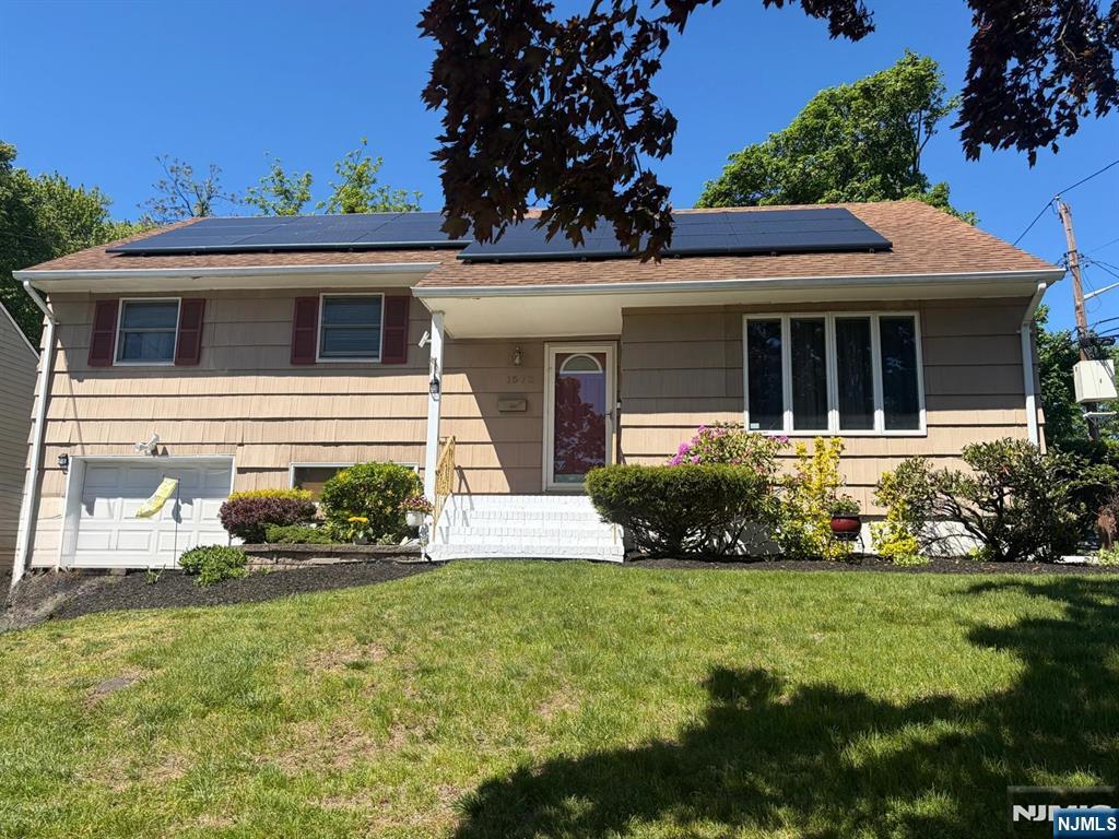 Charming Brookdale AreaCorner Split Level. Bright foyer entry, Cozy eat in kitchen with white cabinets & stainless steel appliances. Opened living room & dining room with beautiful hardwood floors. 3 bedroom/2 Full baths. Master bedroom features full bath and plenty of closet space. Lower level with tv/den, laundry and entry to attached one attached car garage. Central Air. Basement includes family room, office or exercise space. Large backyard with deck. Easy assess to Rt 3. Close to park and NY bus.