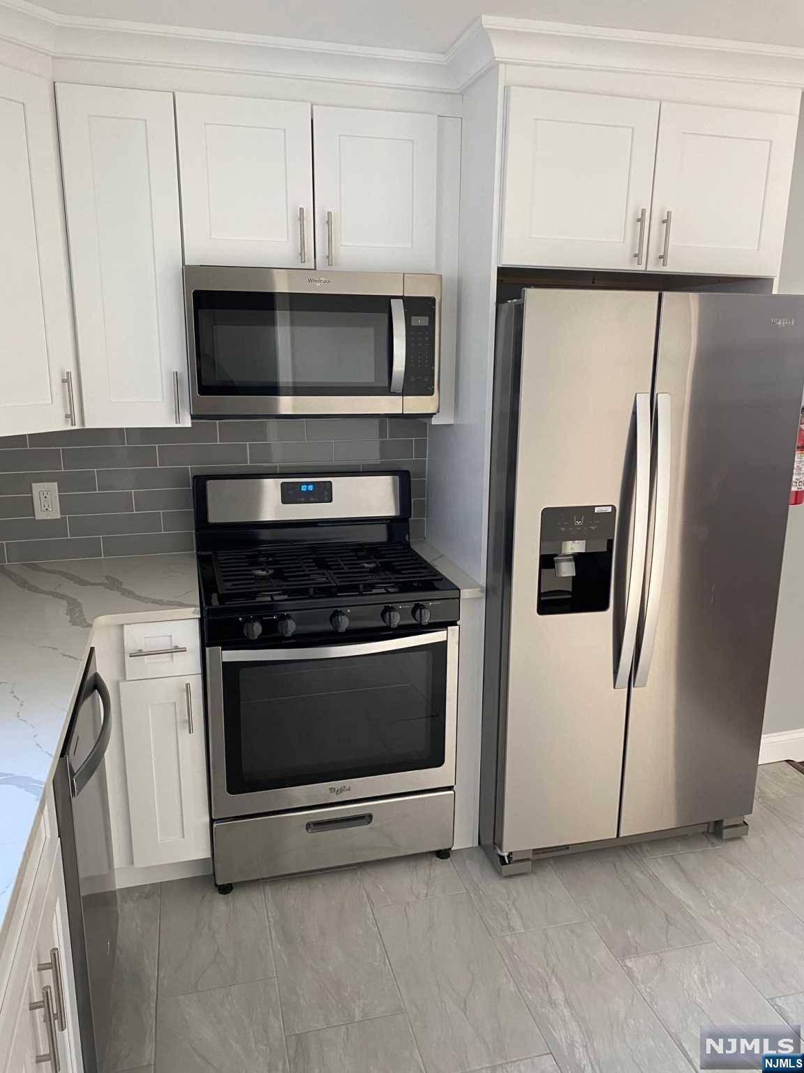 Beautiful renovated home . Hardwood floors through out. Stainless steel appliances , White shaker cabinets with quartz counter tops. Newly installed Heating and cooling system. All newly installed plumbing and electric. Come inside and make this your home or as an investment. Rented at 3k a month