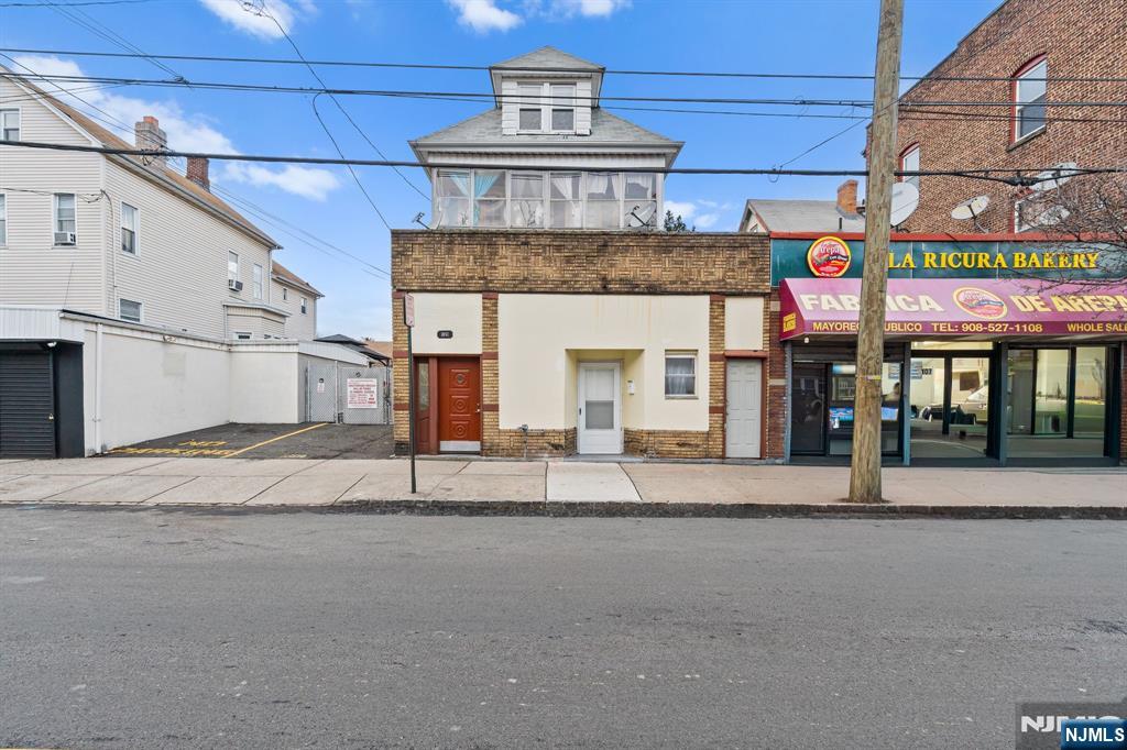 Welcome to this distinguished 4-family residence in the heart of Elizabeth, offering scale, flexibility, and long-term potential. Featuring a total of 9 bedrooms and 4 full bathrooms, and zoned for mixed use. The property is presently operated as a 4-unit residential building, with potential to revert to mixed-use pending review and approval by the Township of Elizabeth. This property presents a compelling opportunity for investors and owner-occupants seeking to add value. There are 2 vacant units. Generous layouts, high ceilings, and abundant natural light provide a strong foundation that preserves the classic architectural character. Situated on a desirable R-3A mixed-use lot in one of Union County's most established neighborhoods, the property benefits from proximity to parks, schools, shopping, dining, and essential services. Commuters enjoy convenient access to major highways, public transportation, and routes to New York City. Whether envisioned as an owner-occupied residence with supplemental income or a strategically positioned investment, this property offers versatility, location, and upside for buyers focused on long-term growth.