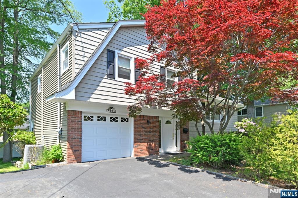 Discover this exceptional sugar maple split situated on a secluded street in Norwood. Upon entering the foyer, you'll notice double closets and elegant French doors that lead to the expansive family room. The family room is conveniently located adjacent to the laundry room and a full bathroom, with direct access to both the garage and backyard. The living room features hardwood floors and a stunning fireplace, seamlessly connecting to the formal dining room. The eat-in kitchen boasts a built-in dining area, newer appliances, and access to the expansive two-tiered deck. The second floor provides a spacious primary bedroom with a half bath and double closets, complemented by two additional bedrooms and another full bathroom. The basement level offers a recreation room and a separate office space. Abundant closet space and additional areas allow for customization to suit your needs. The two-tiered deck has dual exists from within the house and overlooks the park-like backyard. Notable features include a roof approximately 5 years old, leaf guards, multi-zone heating, heating systema dn water heater around 3 years old, and stove and dishwasher less than a year old. Spray foam insulation in the attic. Don't miss this fabulous home!