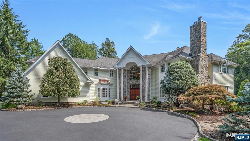 Set in one of Franklin Lakesâ€™ most prestigious neighborhoods, this extraordinary residence blends timeless elegance with modern comfort across three expansive levels. Designed for luxury living and effortless entertaining, it features 5 ensuite bedrooms, 6 full and 2 half baths and a 3car garage. A dramatic two story foyer opens to a formal dining room with butlerâ€™s pantry, a refined receiving room with fireplace, kitchen with high-end appliances, custom cabinetry, informal dining, and a generous walk-in pantry. The kitchen flows into the great room, where a soaring ceiling and stone fireplace create an impressive centerpiece. The first floor also includes a sun room, handsome office with coffered ceiling, a bedroom suite, and two powder rooms, with doors to terraced patios designed for entertaining by the outdoor fireplace, built-in grill, pool, spa, and sprawling lawn. Upstairs, reached by front or rear staircases, are four ensuite bedrooms, a spacious family lounge, full laundry, and a walk-up attic. The private primary suite offers a sitting lounge with fireplace, spa-like bath, and oversized closets. The walkout lower level is equally compelling with a full gym, media room, billiards area, wine cellar, summer kitchen, and bath with steam shower. Outside, resort style grounds showcase manicured lawns, expansive patios, and a heated gunite pool with spa, an ideal backdrop for relaxation and entertaining in one of Bergen Countyâ€™s most desirable communities.