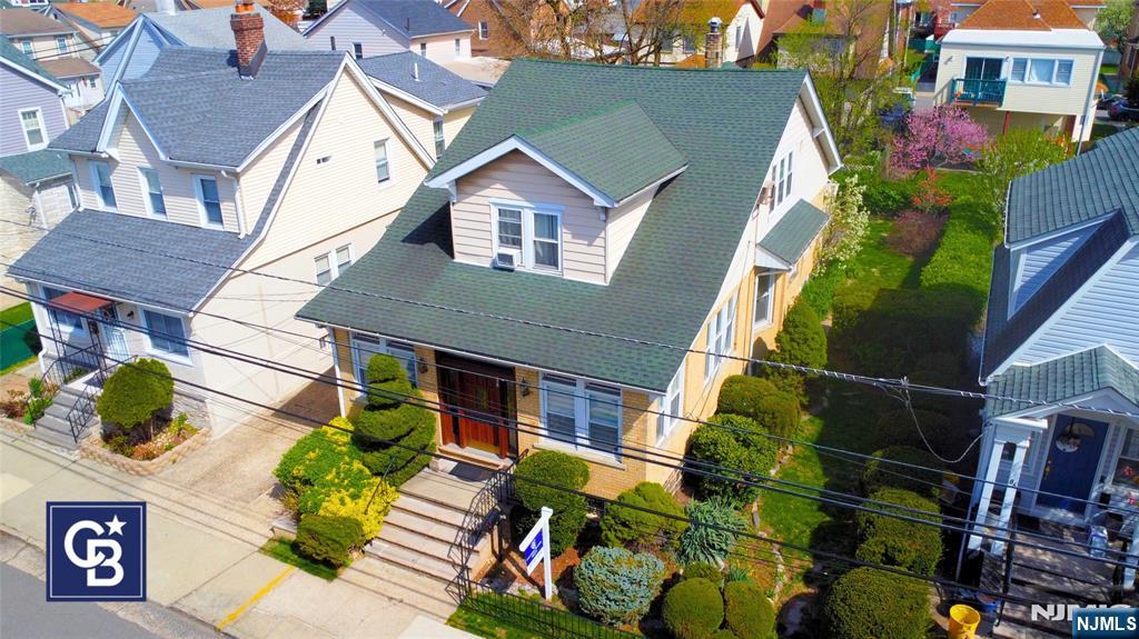 Welcome to 88 Shaler Ave, Fairview, NJ. This two-family home with a unique layout is move-in ready for investors or multi-generational families. First Floor: Den/office, spacious living and dining rooms, kitchen with granite countertops, in-unit laundry, three bedrooms, and a full bath with marble flooring. The finished basement offers high ceilings, a full bath, and a separate entrance. Second Floor: Large living room, dining area, kitchen, full bath, in-unit laundry, and two spacious bedrooms with walk-in closets. Enjoy a backyard perfect for summer, separate utilities, a one-car garage, and a three-car driveway. Conveniently located near New York City, public transit, shopping, and schools.