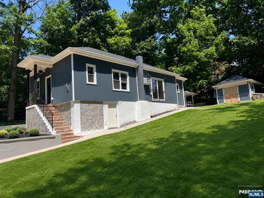 Welcome to this beautifully renovated ranch, nestled in a peaceful, private setting where comfort and modern living come together. Completely remodeled in 2026 with exceptional craftsmanship and attention to detail, this move-in-ready home offers peace of mind with a NEW roof, NEW 2-bedroom septic system, all-new plumbing, updated electrical, and NEW siding. Inside, you'll find gorgeous hardwood floors throughout, two bedrooms plus a versatile bonus room that can easily serve as a home office, guest room, or additional sleeping space. The thoughtfully designed kitchen features quartz countertops, stainless steel appliances, and a built-in beverage refrigerator, perfect for grabbing a refreshment before stepping outside to relax on your private patio. The home also offers 1.5 beautifully updated bathrooms, including a spacious main bath with a double vanity. An unfinished full walkout basement provides endless possibilities to create additional living space, a home gym, workshop, or recreation room tailored to your needs. Outside, a large storage shed with charming barn-style doors offers plenty of room for tools, outdoor equipment, or hobbies. Enjoy seasonal lake views and the convenience of being just a short walk to Capp Beach, where you can take advantage of everything lake living has to offer. Whether you're looking for a full-time residence or a peaceful weekend getaway, this thoughtfully renovated home is ready for you to move right in and enjoy.Grass is virtuallystaged