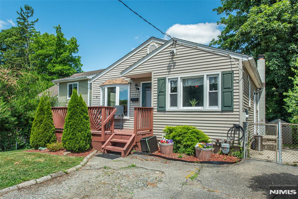 Desirable Lake Parsippany opportunity with lake views! This 2 bedroom 2 full bath ranch offers a functional layout paired with inviting indoor and outdoor living spaces. The kitchen features stainless steel appliances, granite countertops, and updated cabinetry, while hardwood floors add warmth and character throughout the main living areas. The finished basement provides additional flexible living space, perfect for a recreation room, home office, or gym. Outside, enjoy a flat fenced-in backyard complete with a stone paver patio, fire pit, and both front and rear decks ideal for relaxing or entertaining. Conveniently located near lake activities, parks, shopping, dining, and major commuting routes, this home offers the perfect blend of comfort, convenience, and lifestyle.