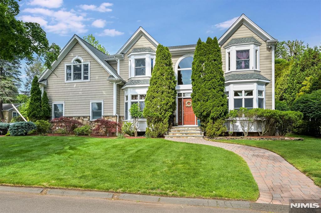 Impressive east-facing renovated center hall colonial offering 4,144 sq. ft. with three levels of beautifully appointed living space designed for both everyday comfort and entertaining. A sun-filled entrance hall welcomes you into the home, featuring an elegant formal dining room, a gracious living room/study with French doors, a family room with a fireplace, a newly renovated full bath, and a bright eat-in kitchen with a center island. The second level boasts a spacious primary suite with a spa-like bath, and four additional bedrooms, and another full bath. The ground level is the ultimate retreat, offering a media room, billiard room, custom wet bar, new Finnish sauna, full bath, and laundry areaâ€”perfect for relaxing or entertaining guests. Outside, enjoy a totally private, professionally landscaped property highlighted by a beautiful custom patio ideal for outdoor dining and gatherings. Even the heated oversized two-car garage has been thoughtfully finished with a tiled floor and has enough space for a workshop. This home has a new roof with 10yr transferable warranty and multi-zone gas hot water heating. Ideally located walking distance to Cresskill's highly rated schools, parks, recreation facilities, swim club, shopping, and fine dining. An exceptional home that combines luxury, comfort, and convenience both inside and out!