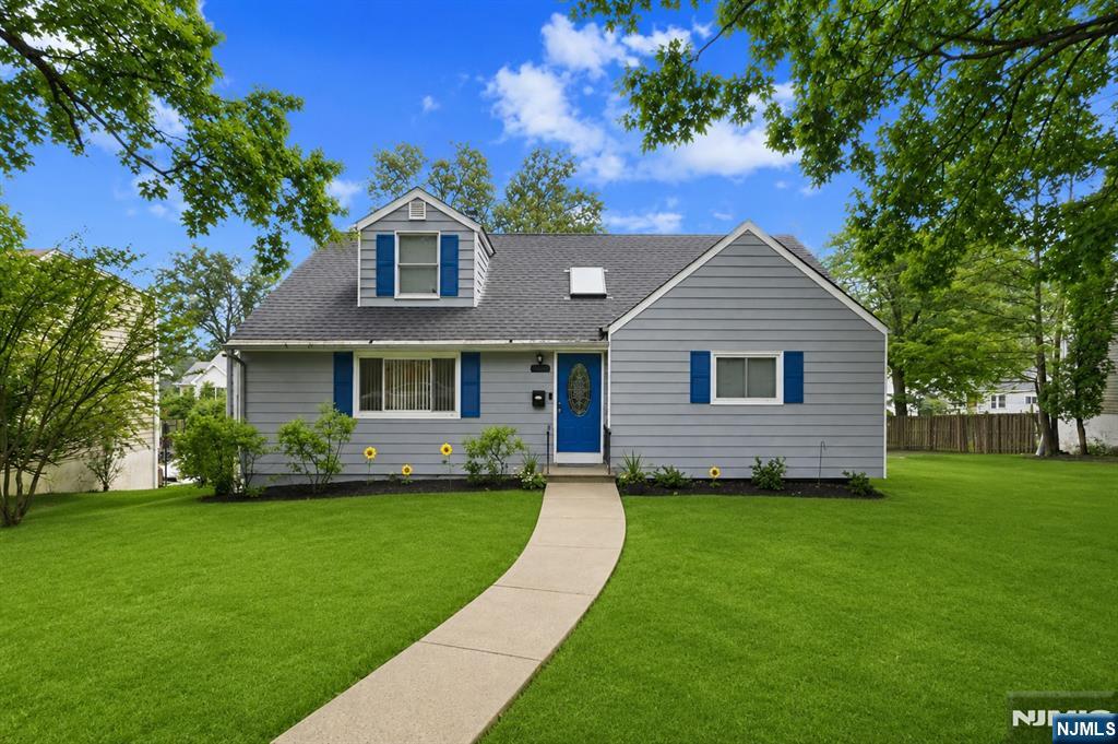 Welcome to this beautifully maintained Cape Cod, situated on a picturesque tree-lined street in West Orange's Saint Cloud neighborhood. Thoughtfully updated, this move-in ready home offers bright, inviting living spaces and a layout designed for comfortable everyday living. The updated kitchen features white cabinetry, granite countertops, and stainless steel appliances, seamlessly connecting to the dining area with sliding glass doors that open to a spacious deck overlooking the expansive backyardâ€”ideal for entertaining or outdoor dining. Rich hardwood floors and oversized windows fill the living room with natural light, while the adjoining sunroom provides the perfect space for morning coffee, a reading nook, or a playroom. Two spacious bedrooms and a full bath complete the main level, while the second floor offers two additional bedrooms and another full bath, providing flexibility for guests, or work-from-home needs. The finished lower level expands your living space with a large rec room, ideal for a media room, or home gym, along with a separate laundry area, additional storage, and direct access to the attached garage. Outside, a long driveway offers ample off-street parking, while the oversized backyard provides endless opportunities for recreation, gardening, or future outdoor enjoyment. Conveniently located near parks, shopping, dining, schools, and major highways, this exceptional home offers the perfect balance of space, comfort, and convenience.