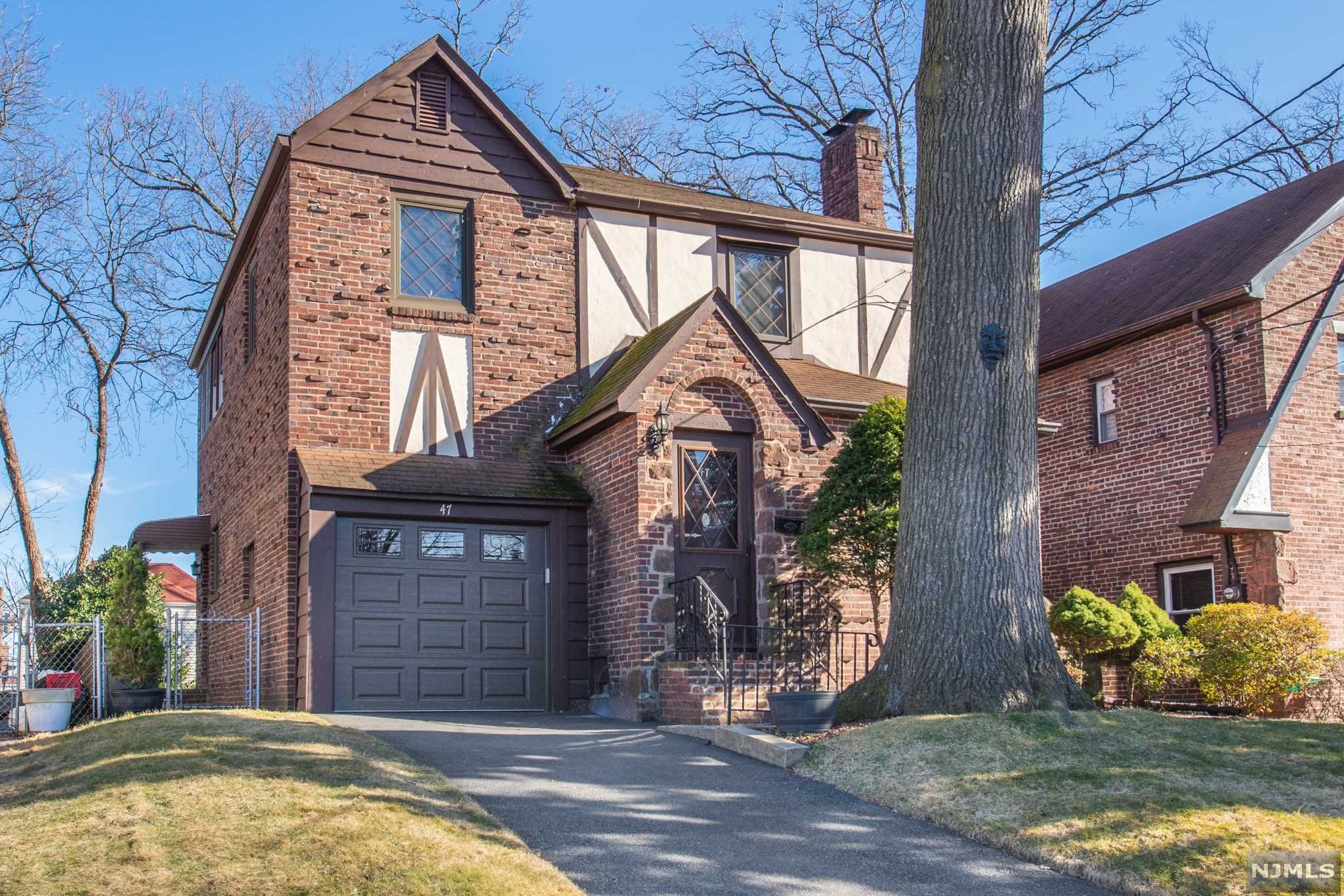 Beautiful & desirable Allwood impressive neighborhood. Wonderful opportunity for this Charming Tudor. Home features: formal living room w/ fireplace, formal dining room & hardwood floors. Kitchen w/ stainless steel appliances & breakfast area. 2nd floor: updated full bath, bedroom w/ on-suite full bath, & additional bedroom w/ 3 season room perfect for playroom and/or office. Full basement w/ storage & laundry. Classic stylish windows with lots of natural light and 1 car attached garage. Great location. Minutes to shopping, restaurants, NY transit, major highways for commuting & New York City.