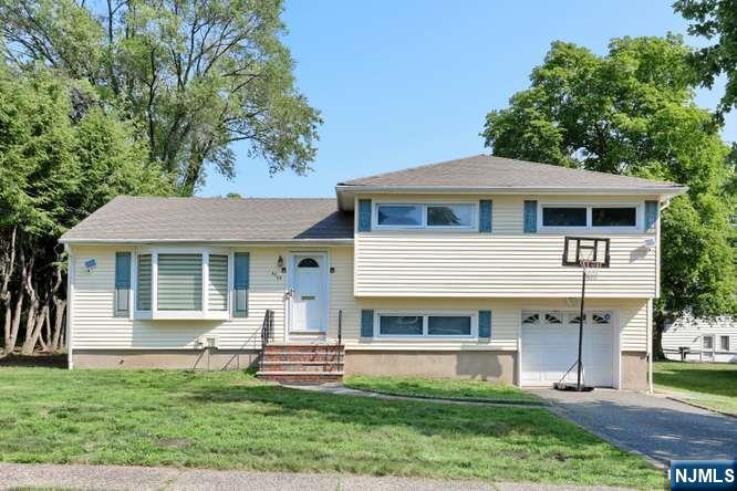 Great, updated Split Level home, located on a nice quiet street in Milnes area of town a couple of blocks from the Saddle River Park. Nice, updated kitchen with modern wood cabinets, granite countertops, stainless steel appliances and a double sink. The Kitchen is conveniently connected to a large Open Dining Room. 2 family rooms, including one large family room on the main level of the house with a decorative Fireplace and the other on the ground level. Every door in the house was remodeled to a high-quality wood door. Laundry includes extra-large Bosh washer and dryer. The house has a recently beautifully remodeled basement with closet galore. There are LED energy efficient recessed lighting in every room and hardwood floors throughout. Newer large deck and one car attached garage. The house is conveniently located walking distance from transportation. If you transfer the x-large washer and dryer to the basement, there is possible room to add a shower stole(cabin) on the ground floor.